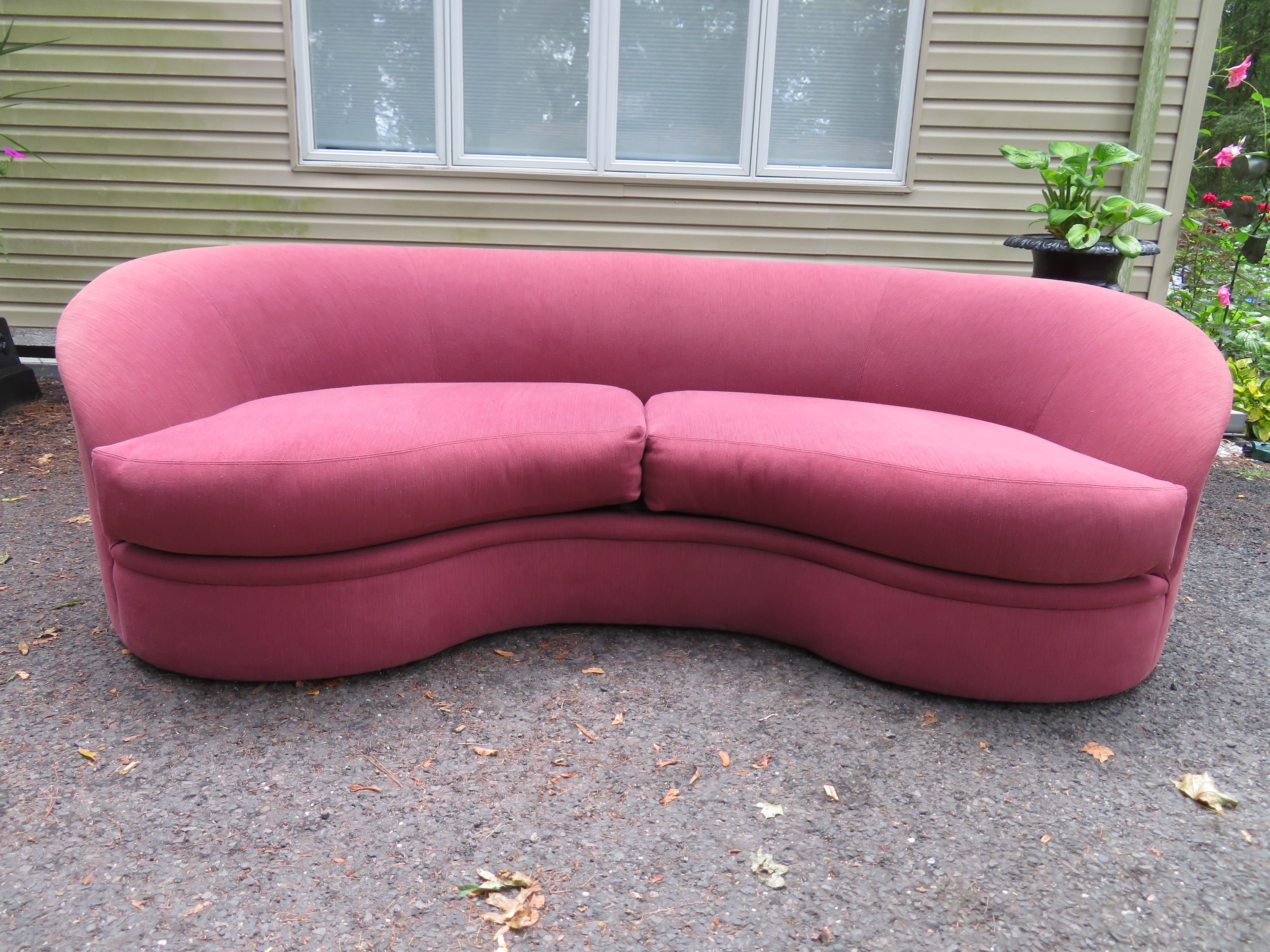 Wonderful biomorphic kidney bean shaped sofa with Directional label-Vladimir Kagan style. This piece retains its original upholstery which shows a bit of wear-some fading and minor spots. As with all original upholstery we do recommend re-upholstery
