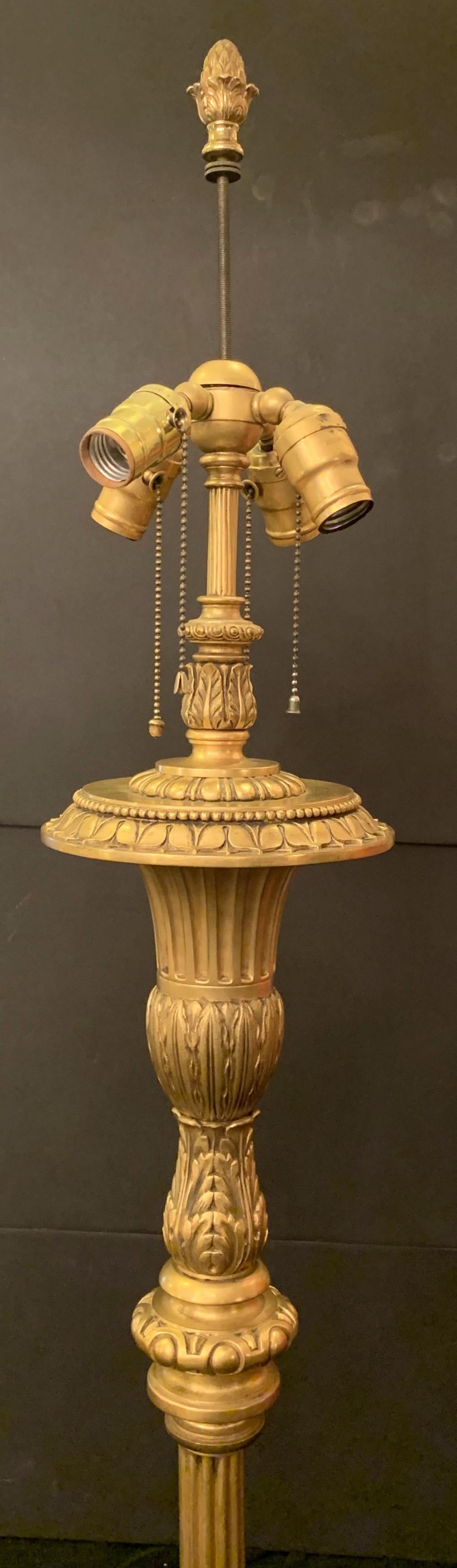 A wonderful French gilt urn form and filigree regency gilt bronze floor lamp in the manner and high quality of E.F. Caldwell with 4 Edison lights and adjustable height center.
Rewired and ready to enjoy.