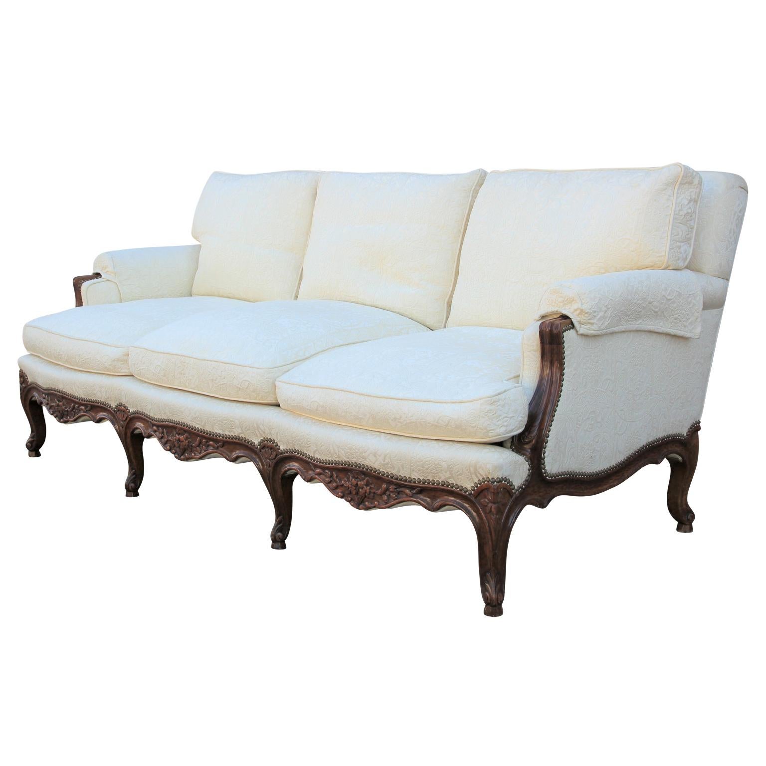 Wonderful Italian carved Rococo three-seat sofa. Excellent quality, circa mid-early 20th century. The fabric is original and very useable, however for perfection COM is suggested.