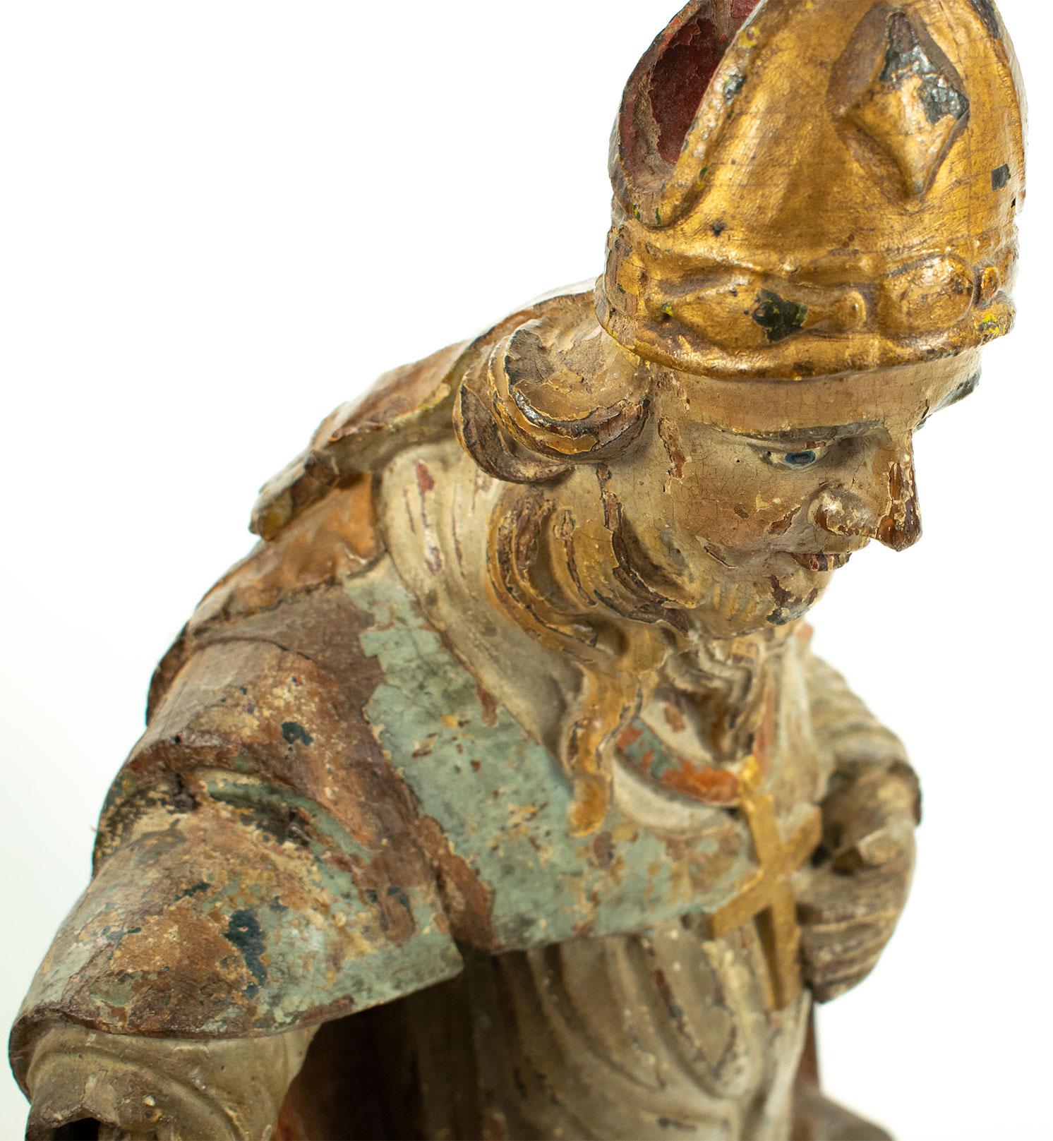 Petrified Wood 16th century Italian carved wooden polychromed statue of Saint Francis For Sale