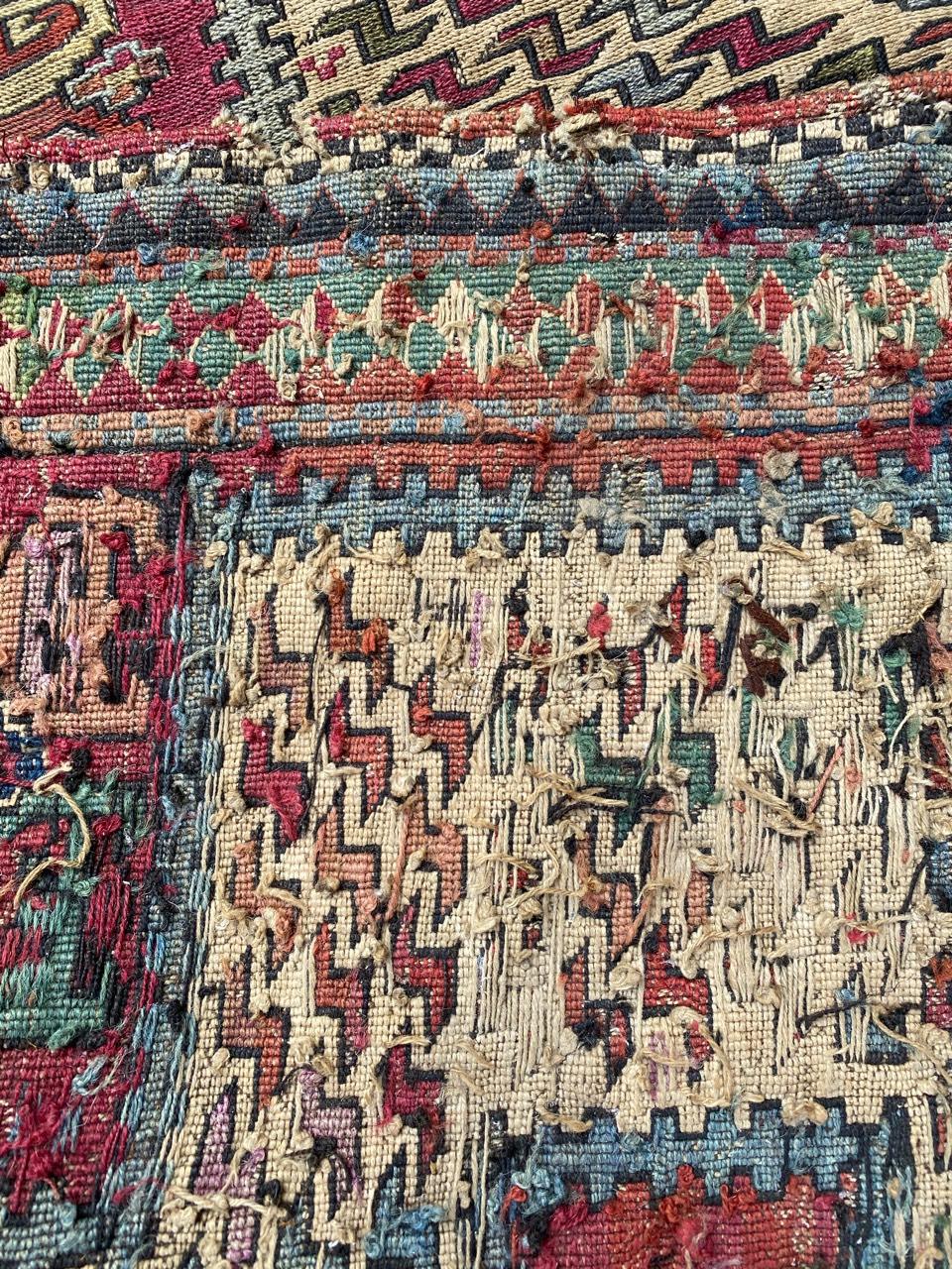 Very beautiful late 19th century or early 20th century Caucasian verneh Kilim with a tribal and geometrical design and beautiful colors, with blue, purple, green, pink and yellow, entirely hand embroidered with wool on wool.