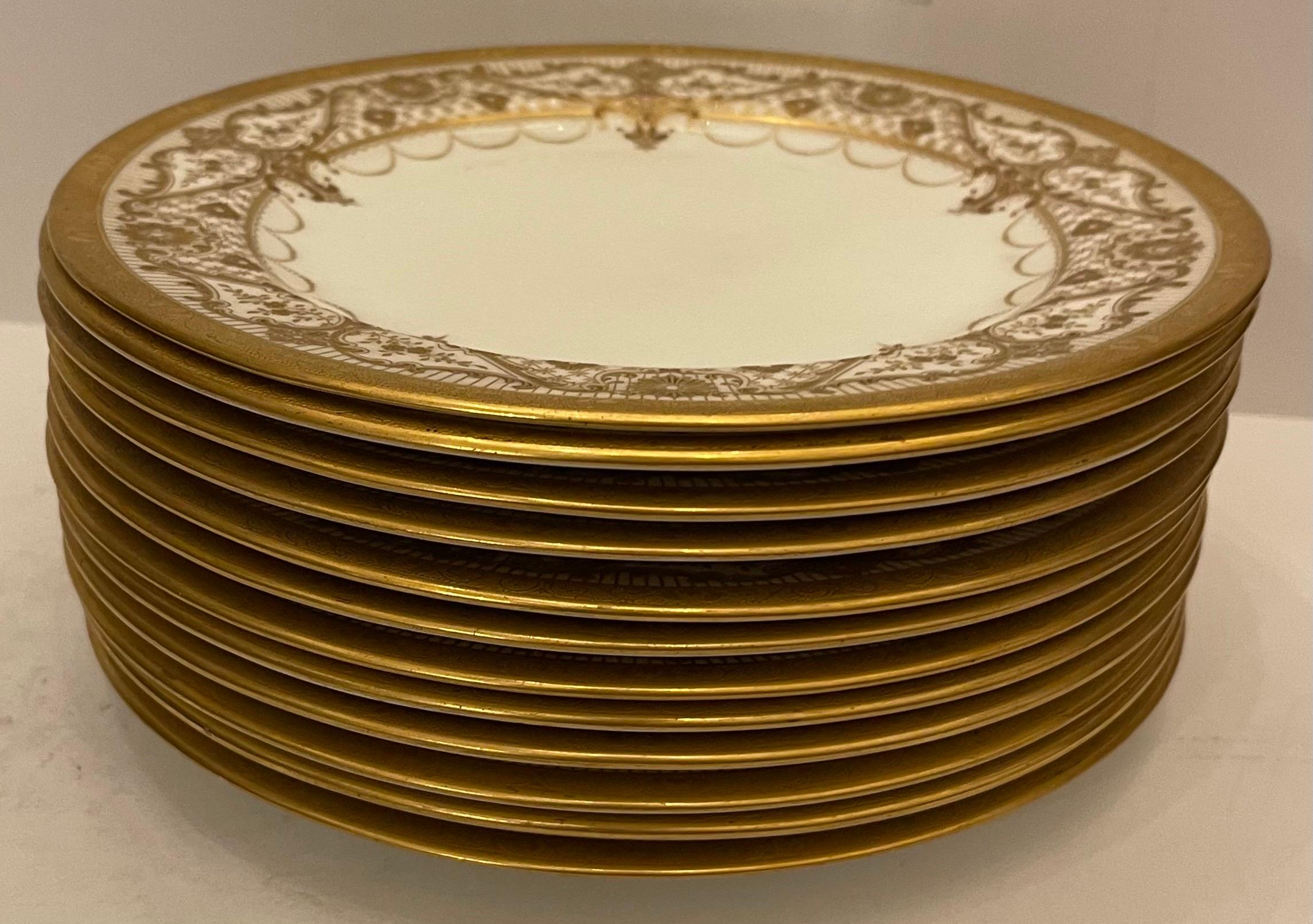 A wonderful service of cauldon England consisting of set 12 lunch / dessert plates with raised gold encrusted border rim.
Retailed By:
Higgind & Seiter New York.