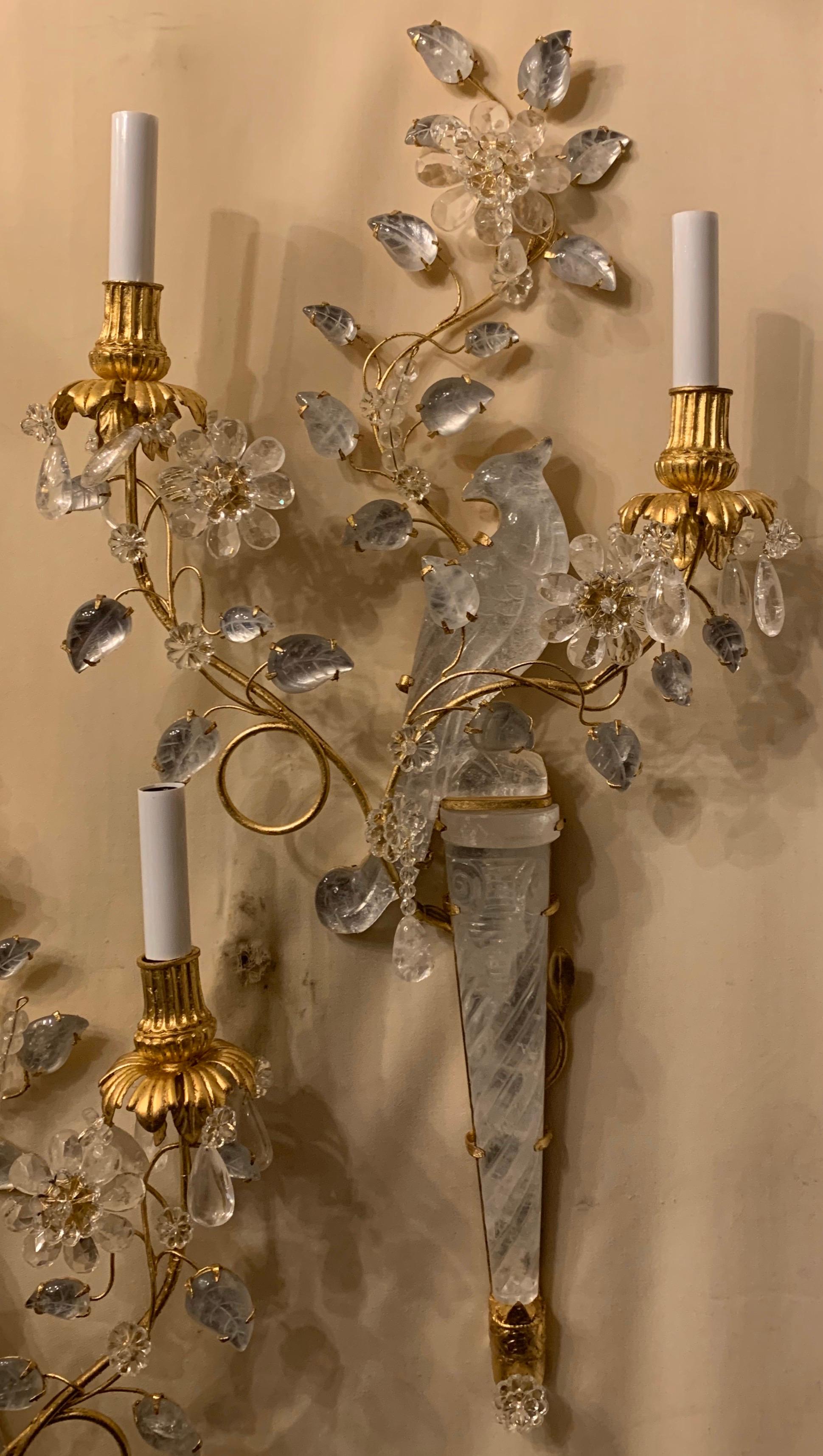 A wonderful pair of chinoiserie motif rock crystal two-arm with new candelabra sockets and wiring gilt bird form parrot sconces with flowers.

3 Pairs Available
Each pair sold separately
