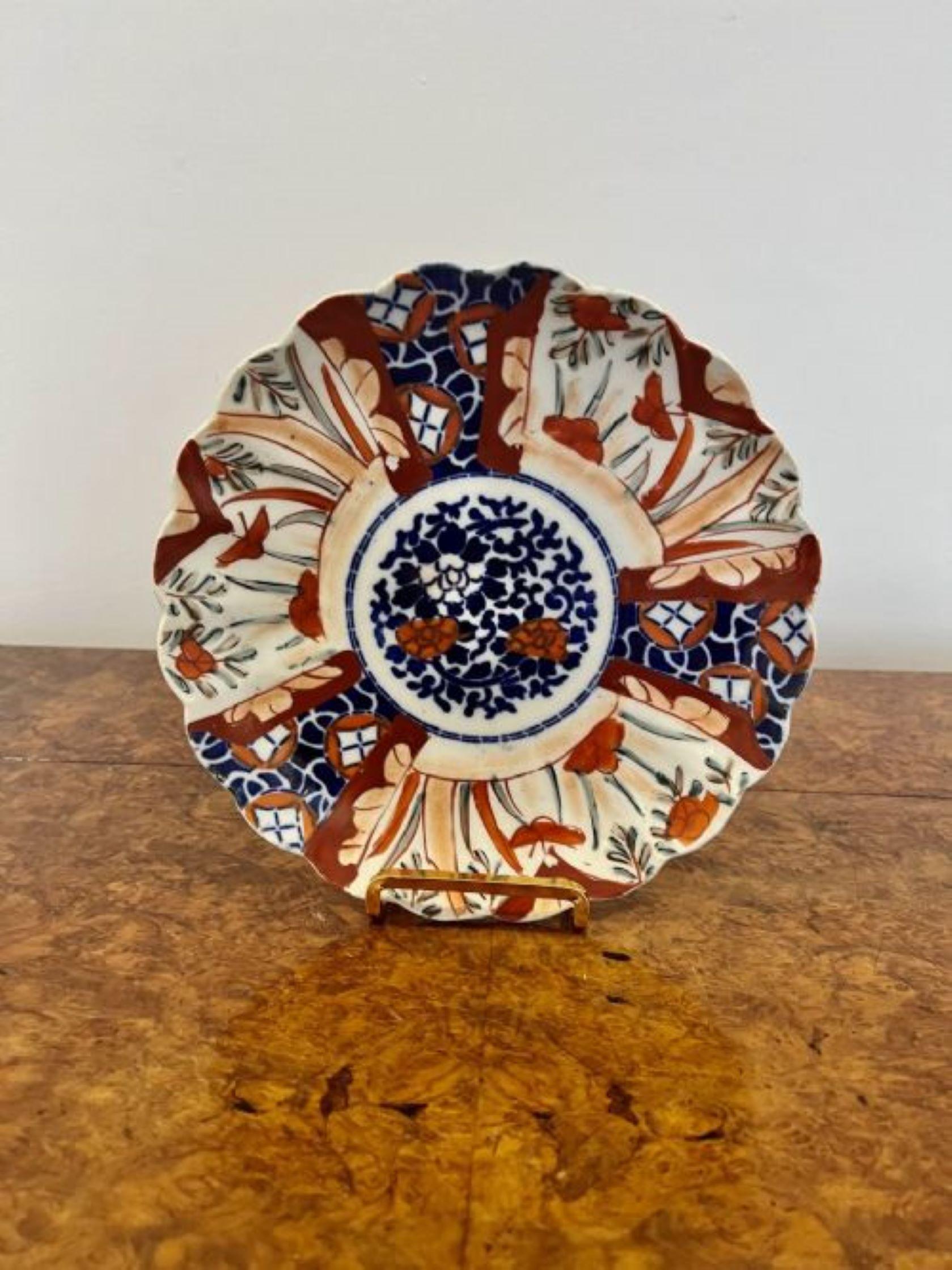 Wonderful collection of three antique Japanese imari plates, with scallop shaped edges, having quality hand painted panels with flowers, leaves and scrolls in wonderful red, blue, green and white colours