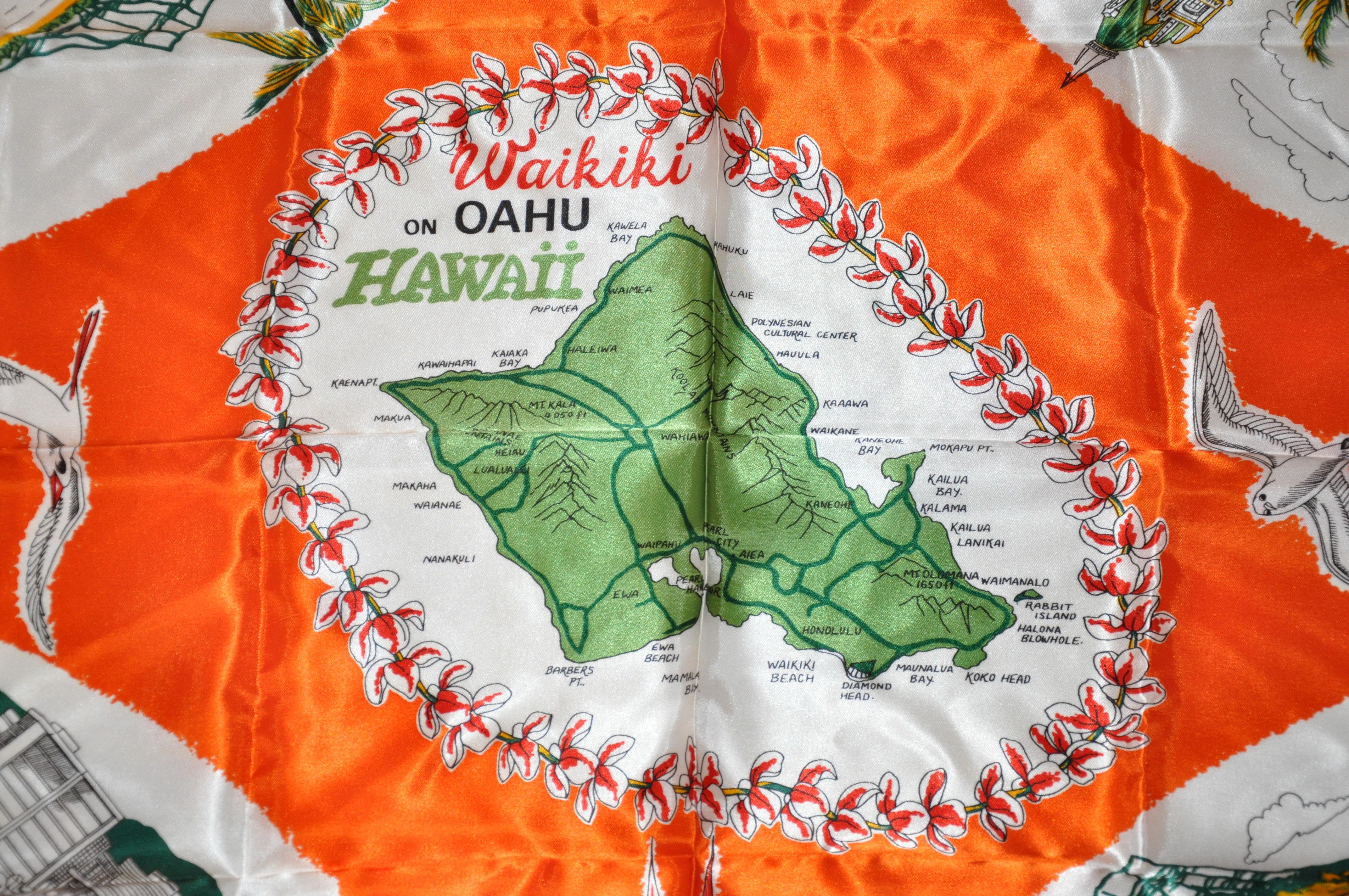        This wonderfully bold and colorful tangerine with scenes of Waikiki On Oahu Hawaii scarf with rolled edges, measures 26 inches by 27 inches. Made of acetate satin and made in  Japan.