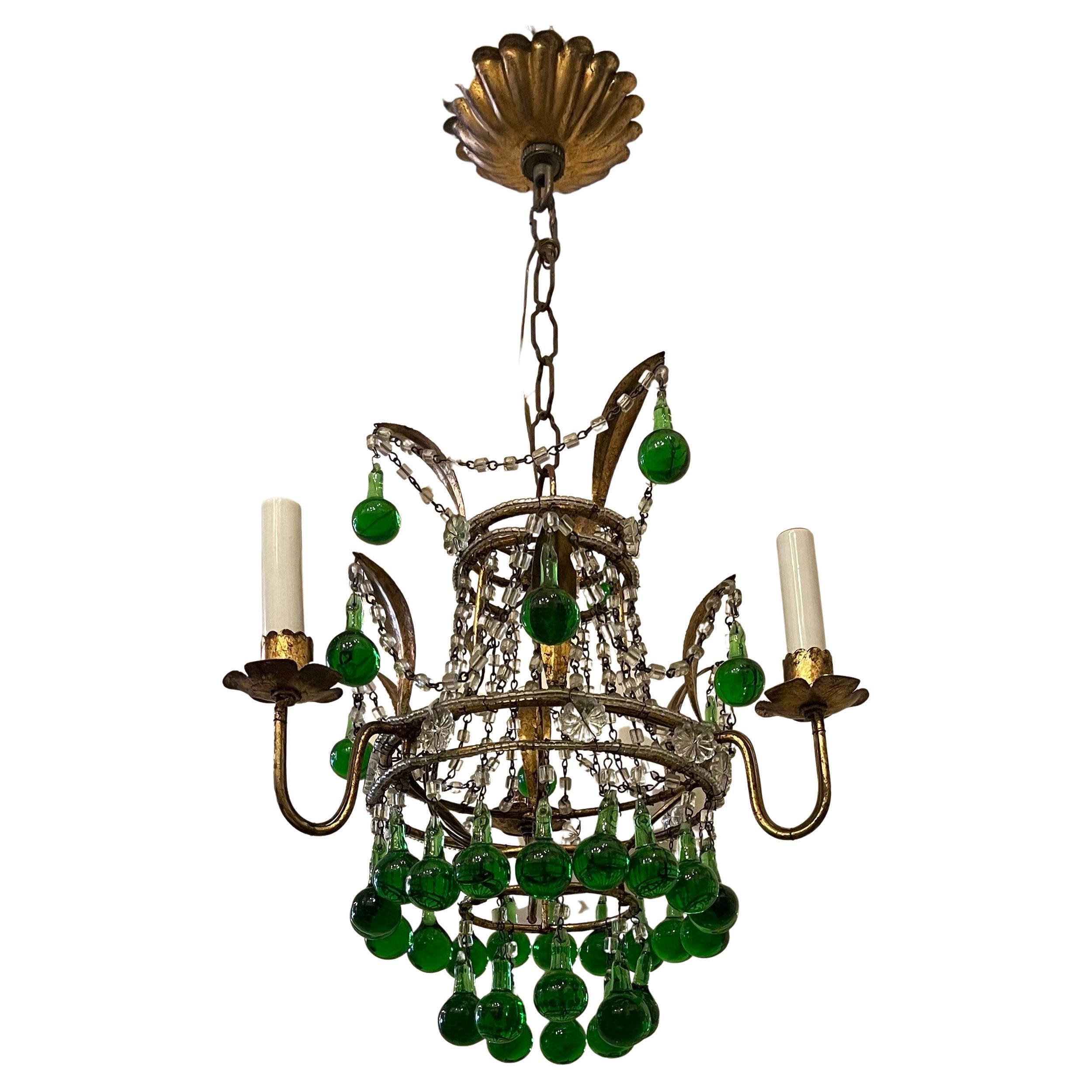 A wonderful crystal beaded gold gilt with emerald green tear drops this italian petite chandelier fixture has 3 candelabra lights.