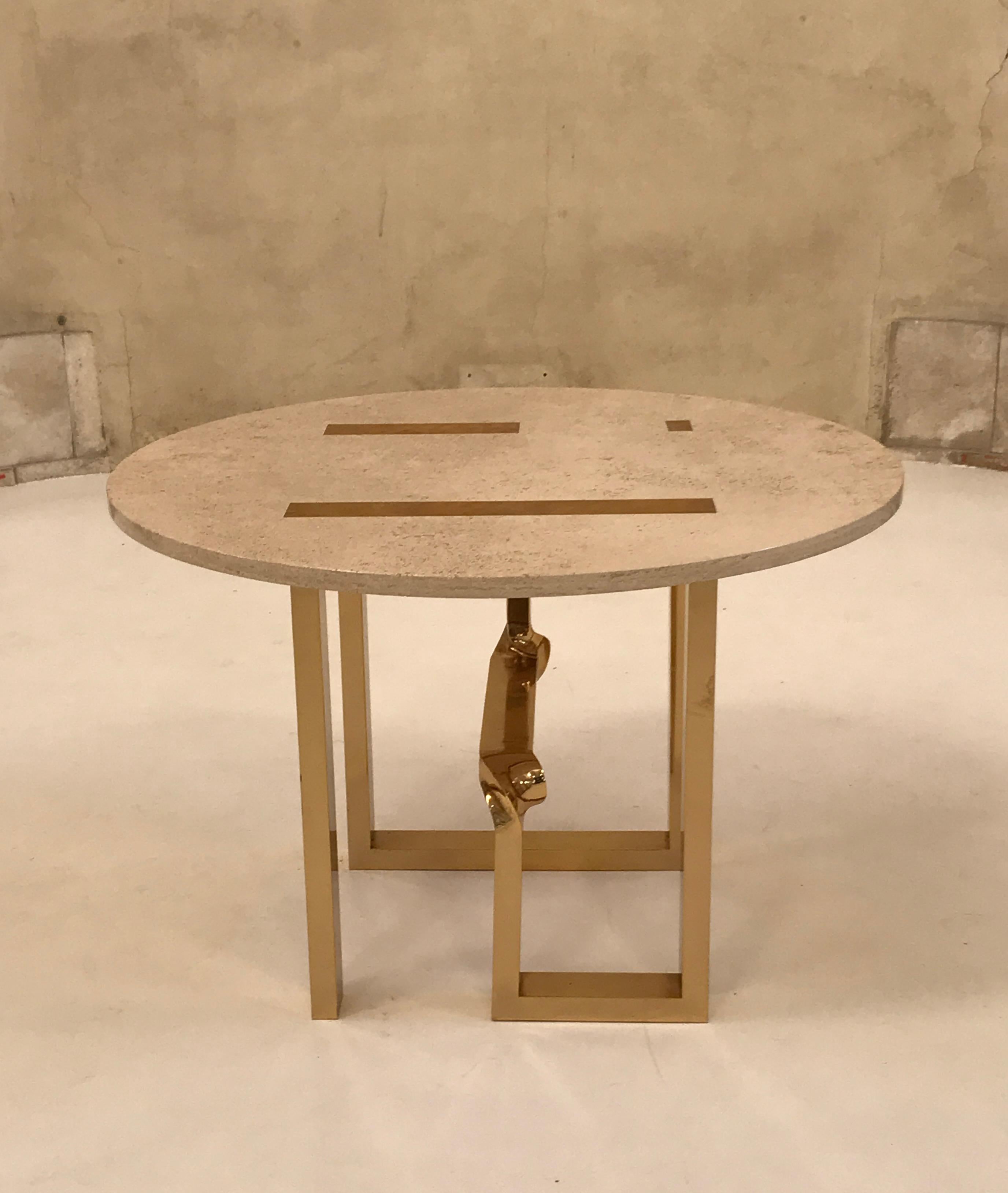 Charming brass and marble dining table by Cittone Oggi. 
Magnificent brass details carved on the marble top. 
Sculptural brass base.