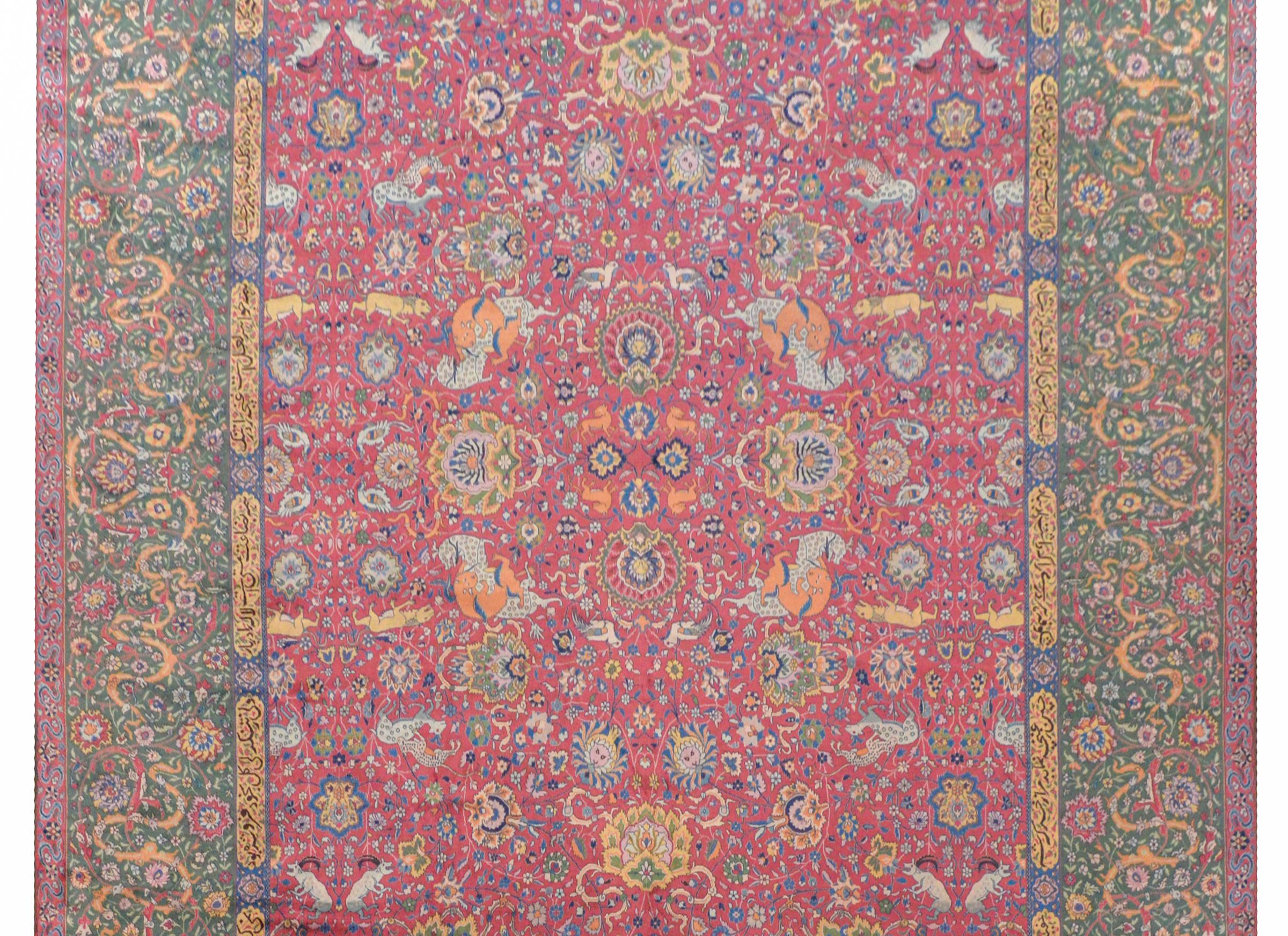 A wonderful and whimsical early 20th century Indian Agra rug with an all-over pattern of large-scale flowers and scrolling vines, and myriad animals including birds, lions, leopards and lions hunting deer, and antelope, all woven in myriad colors on