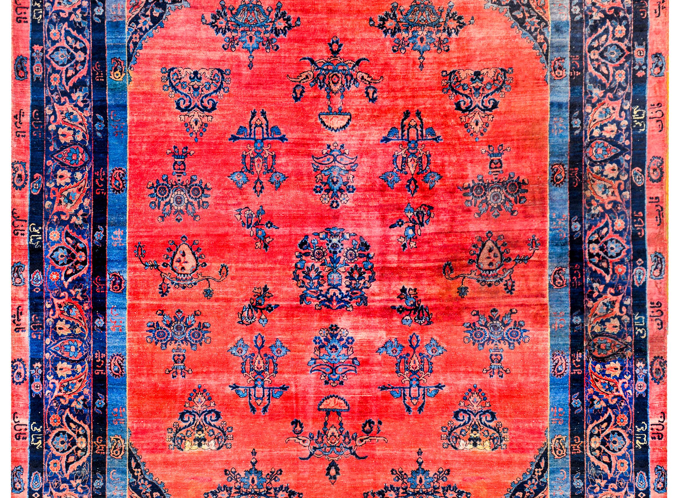 A wonderful early 20th century Persian Kashan rug with a fantastic abrash red field with multiple floral 