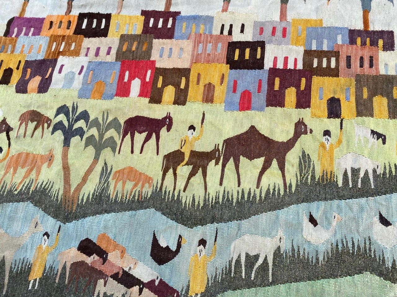 Very beautiful mid century Egyptian tapestry Kilim  (in style of Egyptian Ramsès Wissa Wassef School Tapestries) with nice childish design showing a village with dwellings, people and animals, and beautiful colors, entirely hand woven with wool