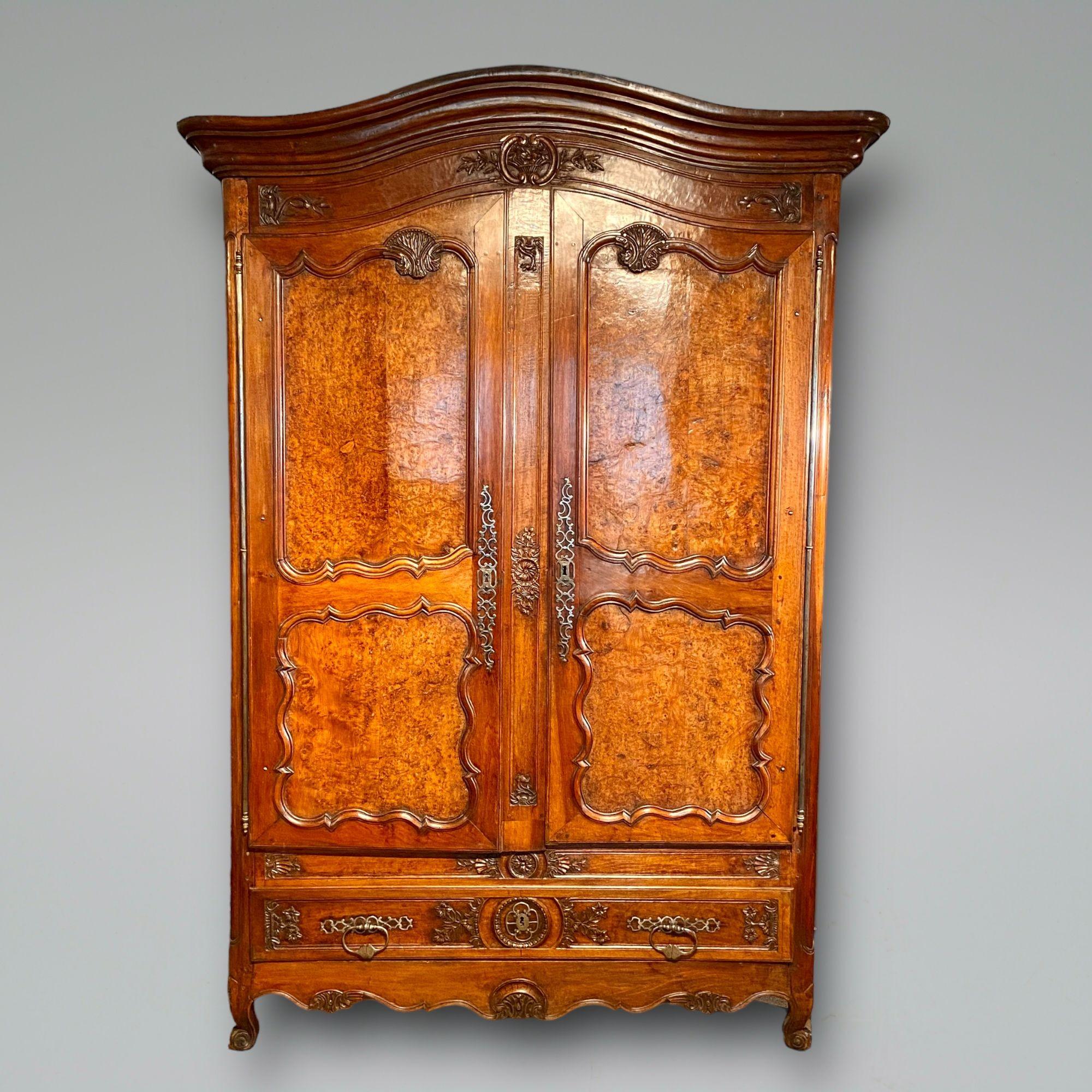 A fine walnut armoire with super original metal work, the panels in the doors with the unusual feature of having beautiful burr walnut. Great colour and patiation
Possible Lyon region circa 1790.