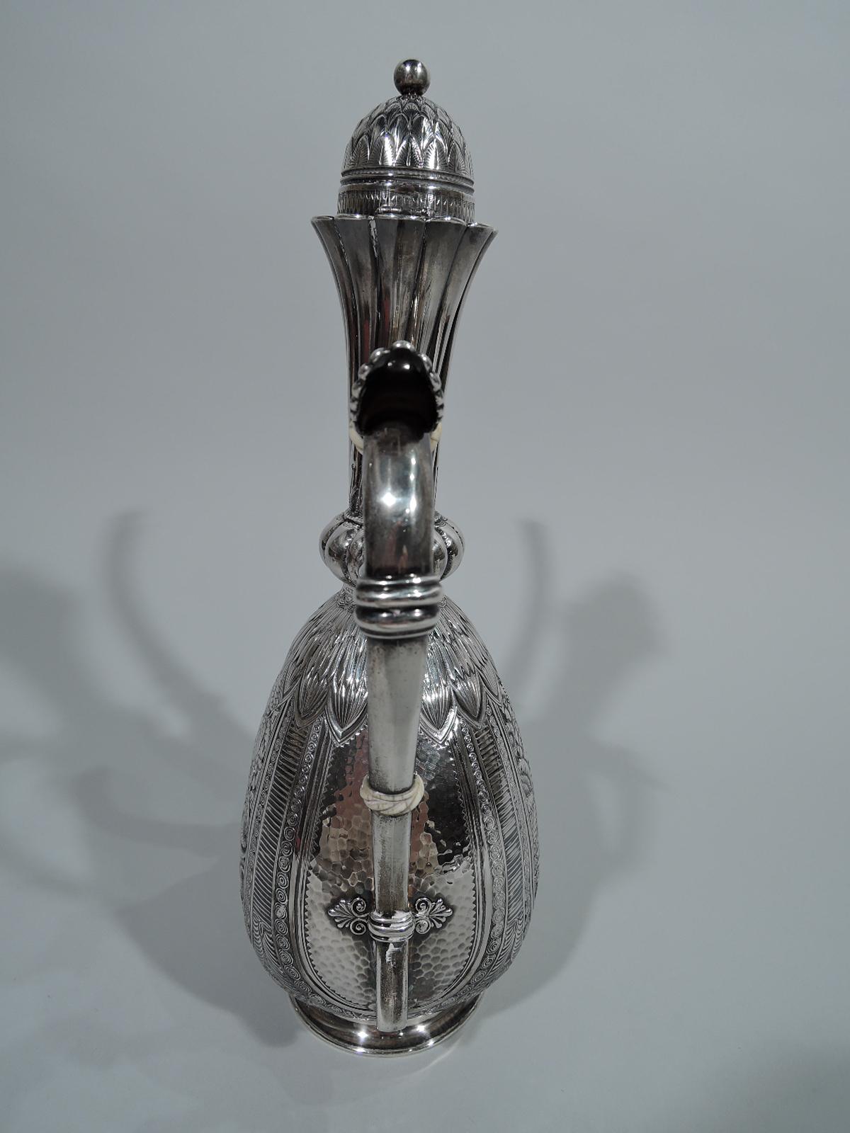 Exotic sterling silver Turkish coffeepot. Made by Gorham in Providence in 1881. Flat ovoid body with lobed knop, tapering cylindrical neck with twisted fluting and scalloped rim, inset hinged domed cover, s-scroll handle, and vertical s-spout.