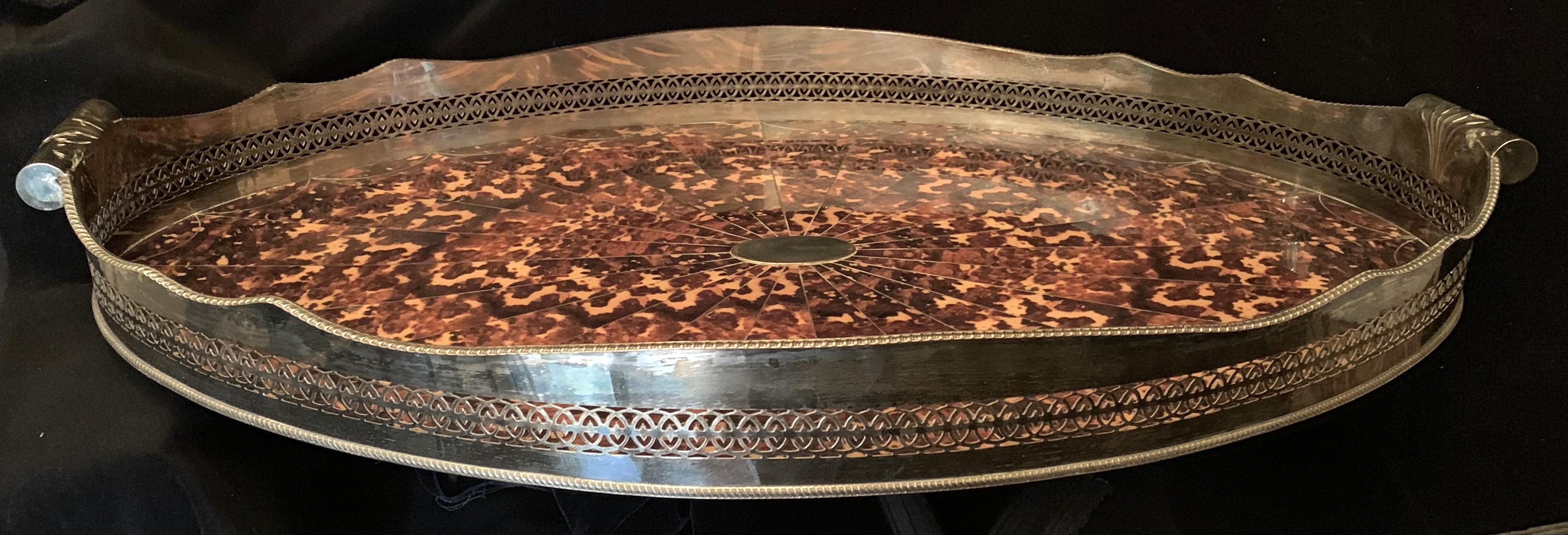 A wonderful large faux tortoiseshell and silver plated oval pierced gallery tray with handles.
 