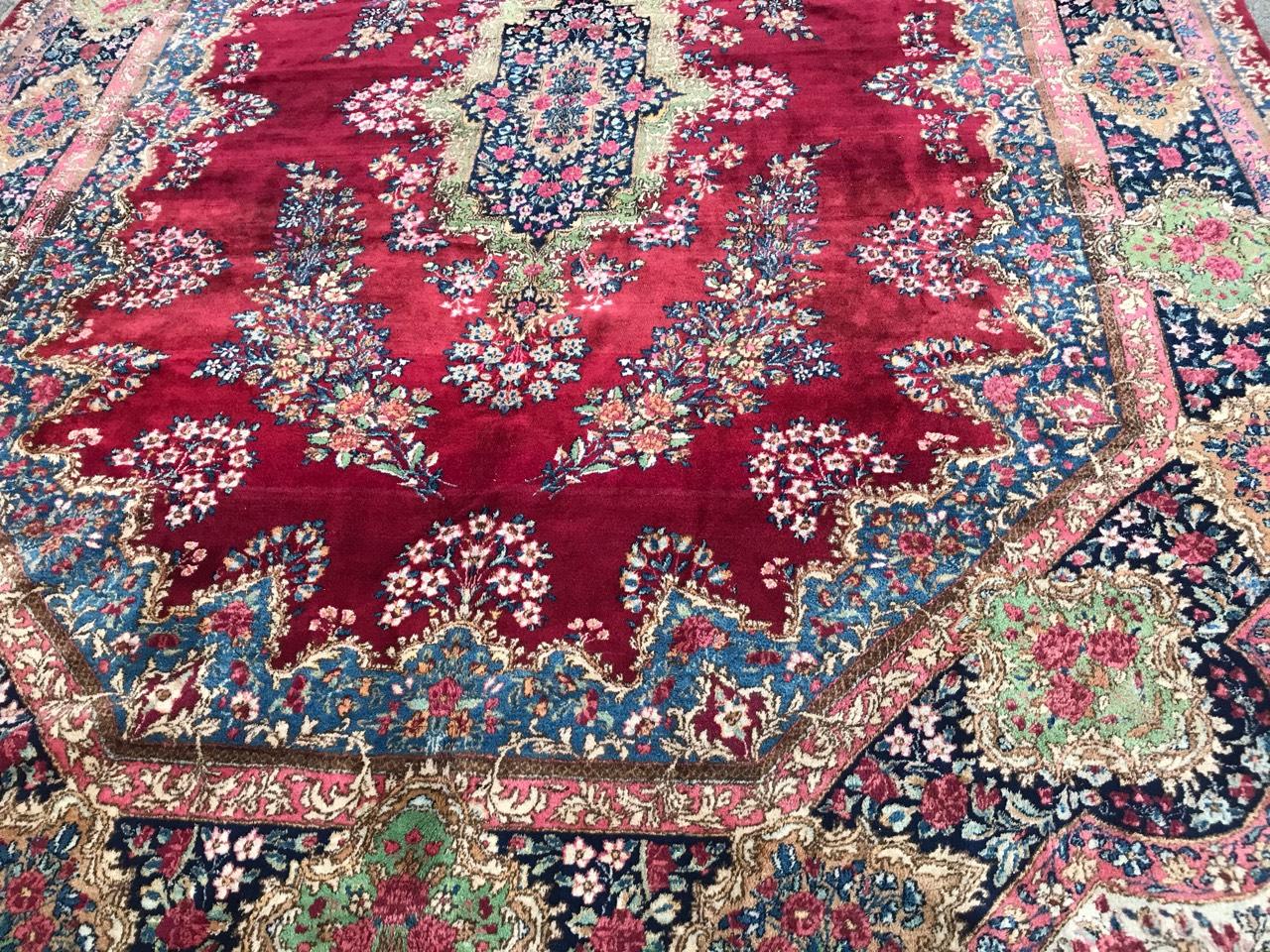 Discover the timeless elegance of this exquisite antique rug featuring a floral design reminiscent of French Savonnerie carpets. Adorned with a beautiful array of flowers and a central floral medallion, this rug boasts vibrant colors set against a