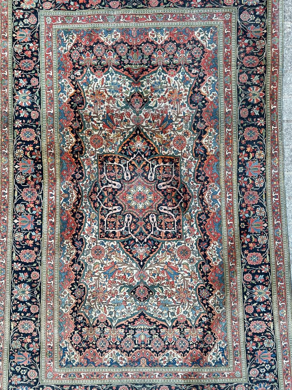 Very beautiful and rare antique Mohtasham Kashan rug with nice floral design and beautiful natural colours with a white field, dark blue field on borders, red, blue, yellow, orange, green and pink in design, entirely and very finely hand knotted