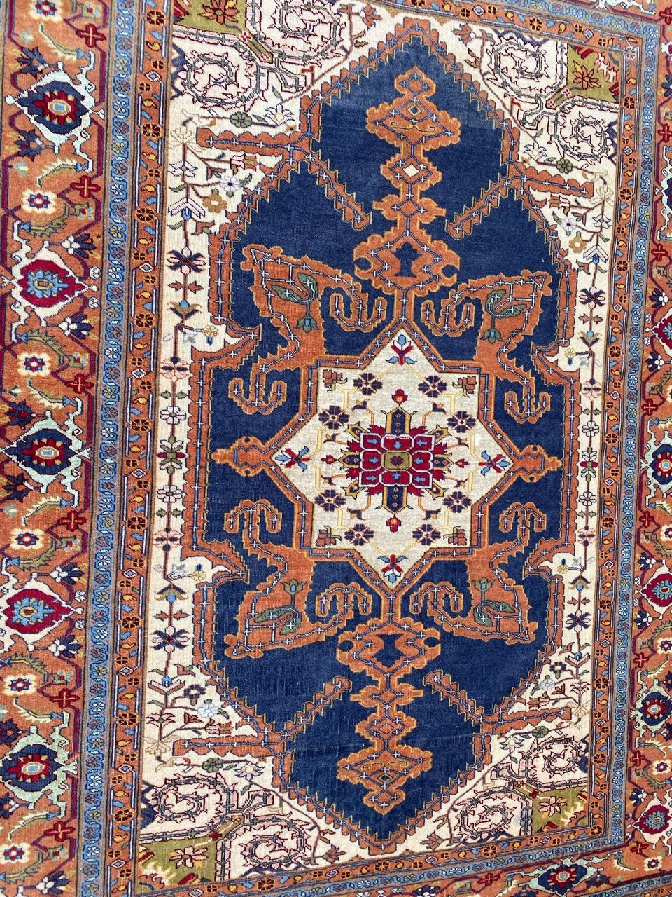 Very beautiful late 20th century rug with a beautiful decorative design and nice colors, entirely and very finely hand knotted with wool and silk on wool foundation.