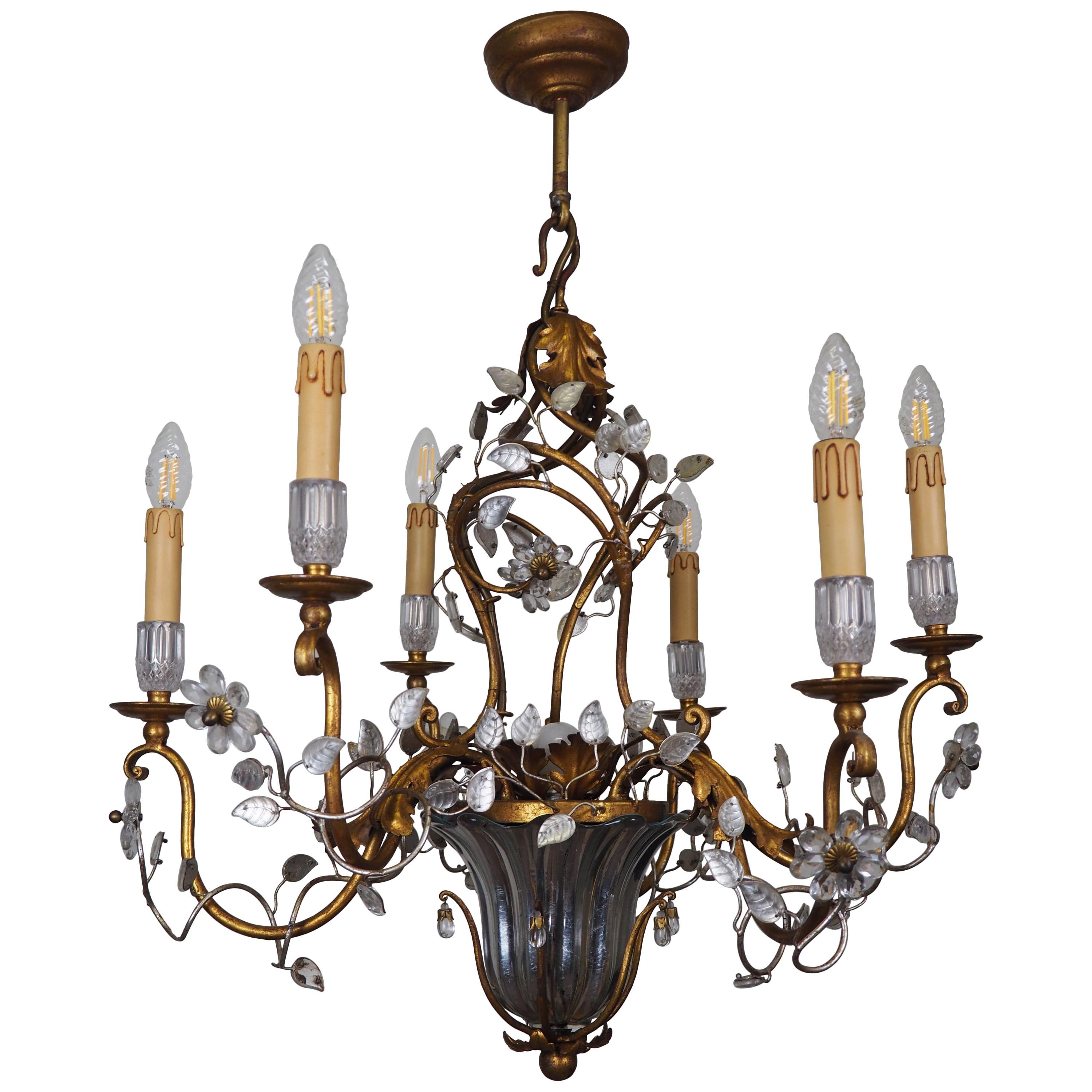 A wonderful Italian gilt iron and crystal flower leaves chandelier by Giovani Banci, circa 1960s.

Socket: 6 x e14 for standard screw bulbs.

The condition is excellent.



  