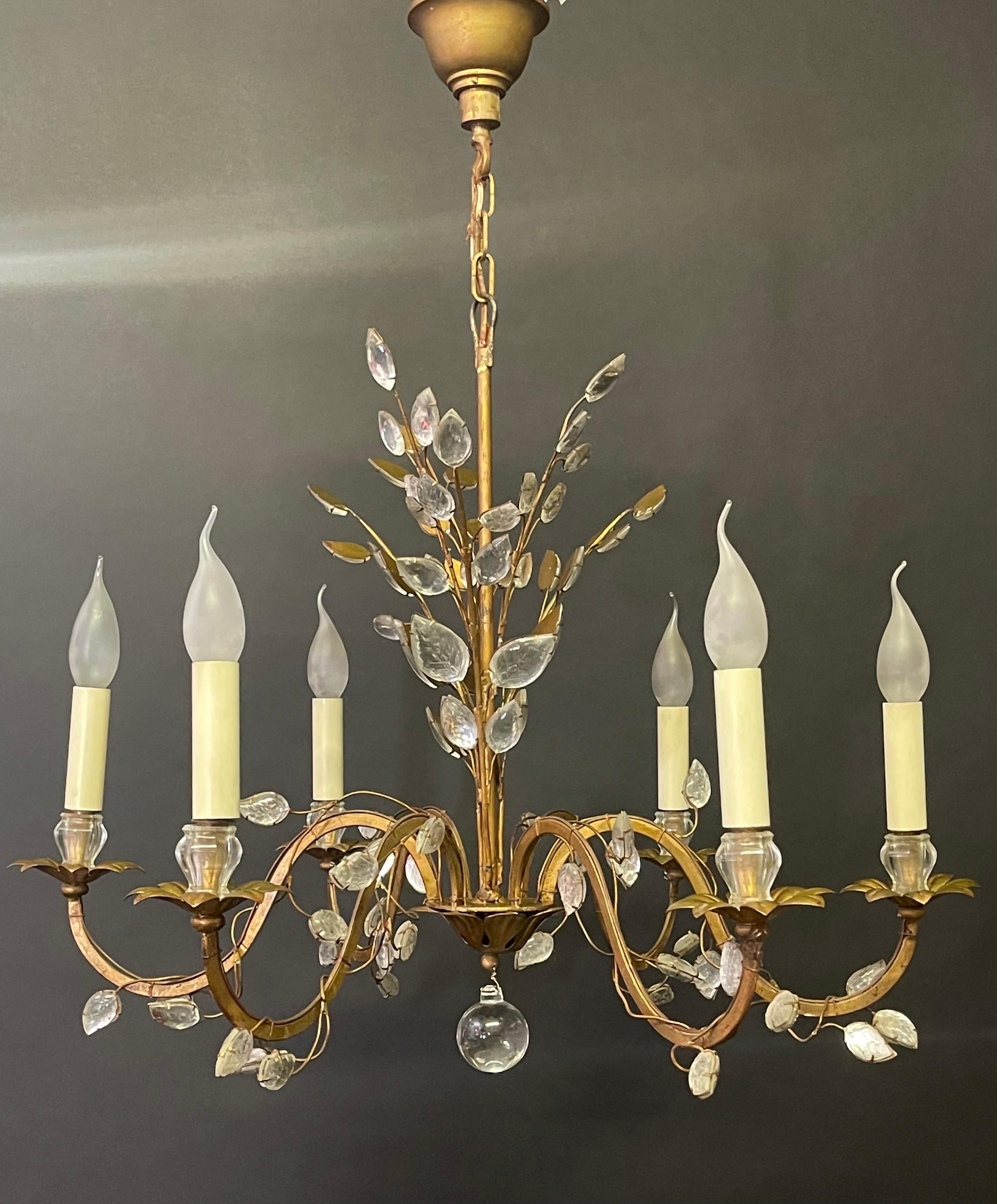 A wonderful six-arm gilt iron and crystal flower chandelier by Maison Baguès, Paris, circa 1950s.

Socket: 6 x e14 for standard screw bulbs.

The condition is excellent.



