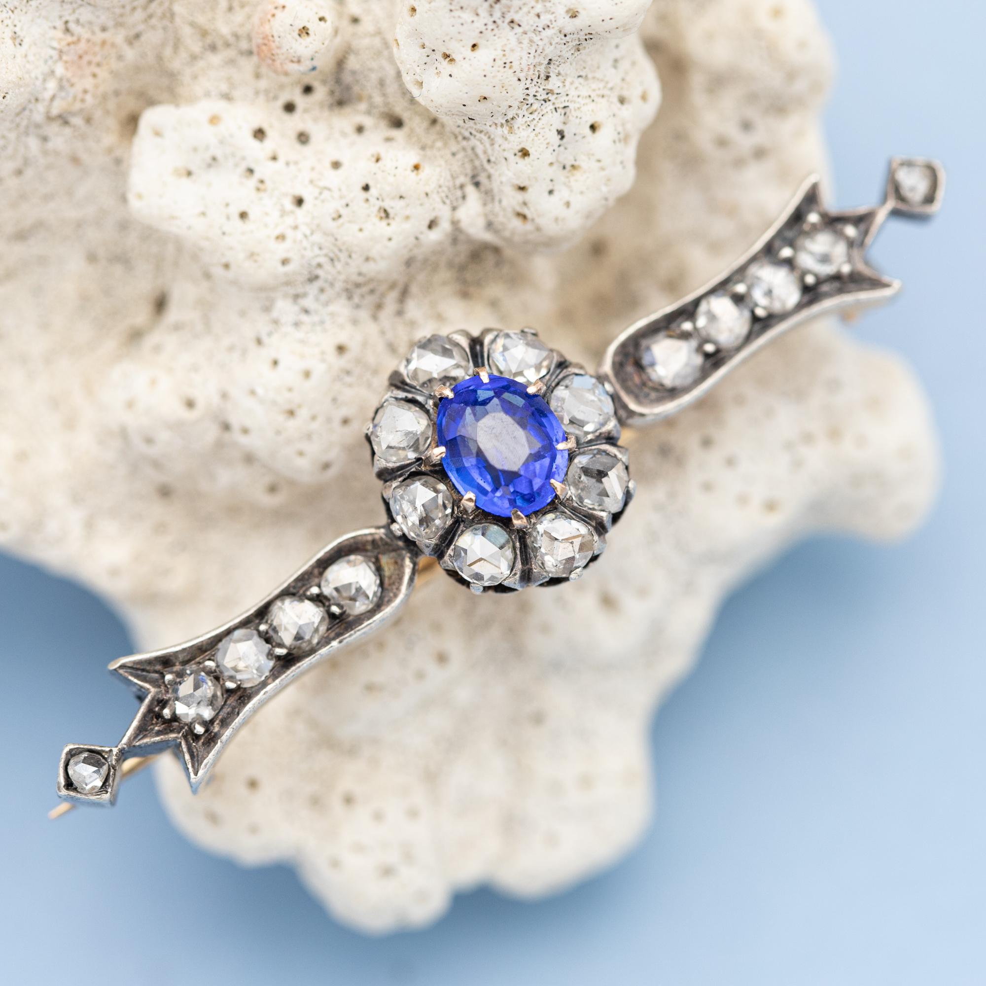 For sale is this Marvellous 18 K gold and silver Victorian brooch. This piece was crafted during the 19th century in France and is therefor also called a Napoleon III jewel. This stunning floral themed bar brooch is set with a bright blue sapphire,