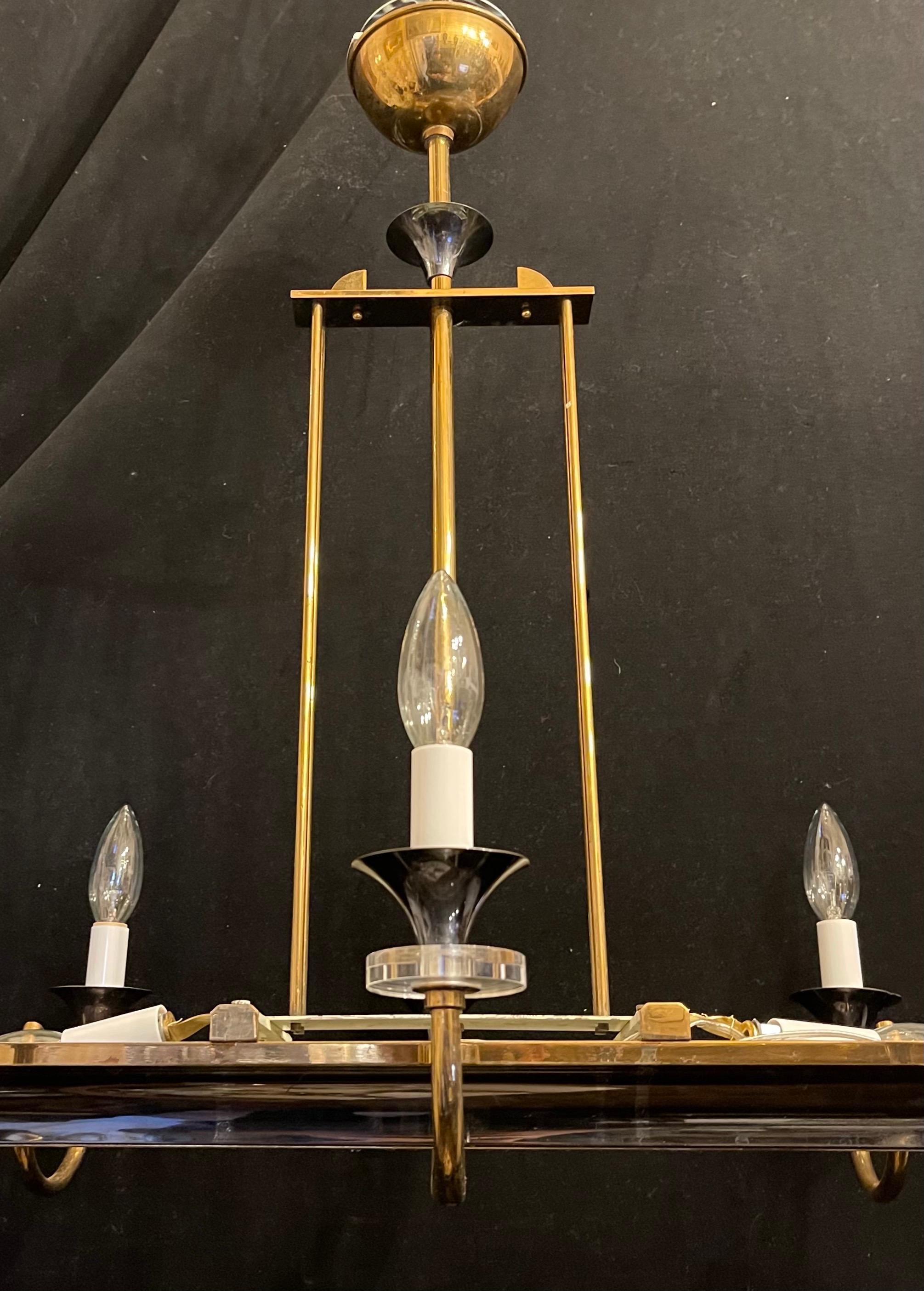 A wonderful French Art Deco / Mid-Century Modern bronze / brass patina with reeded glass panel 8 arm chandelier with 2 interior lights, this fixture has been completely rewired with new sockets.