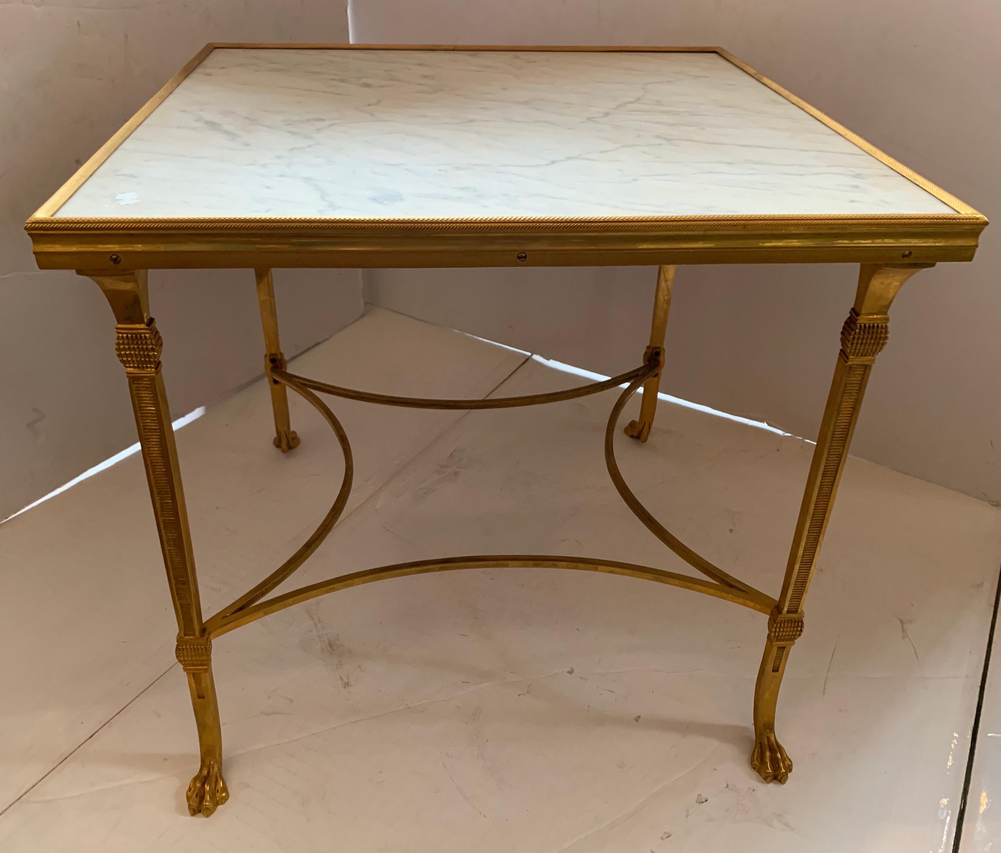 A wonderful French Baguès style gilt bronze paw marble three-part cocktail coffee table.