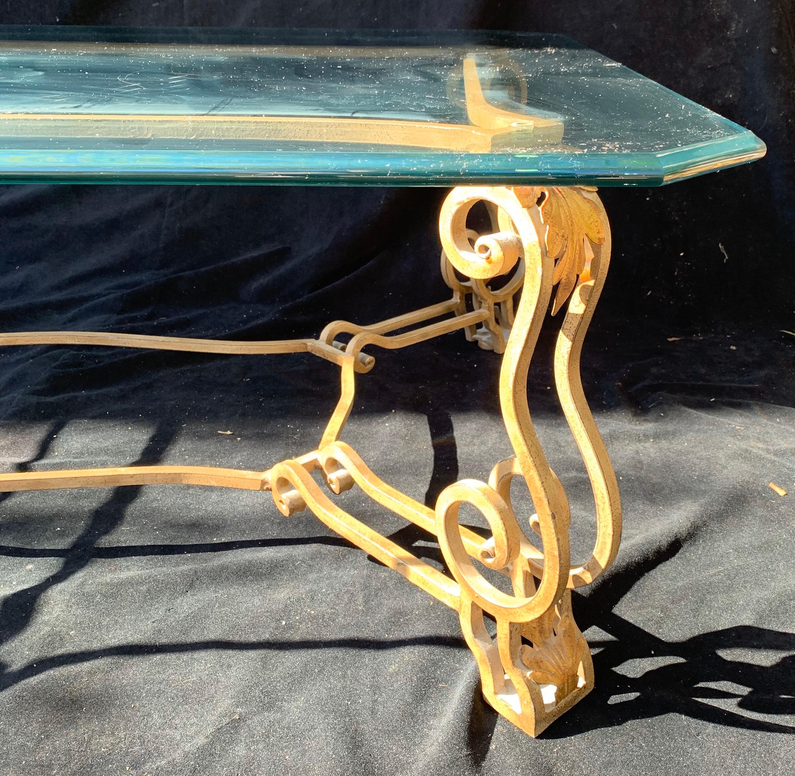 A wonderful French gilt iron scalloped / ogee edge glass coffee / cocktail table.
