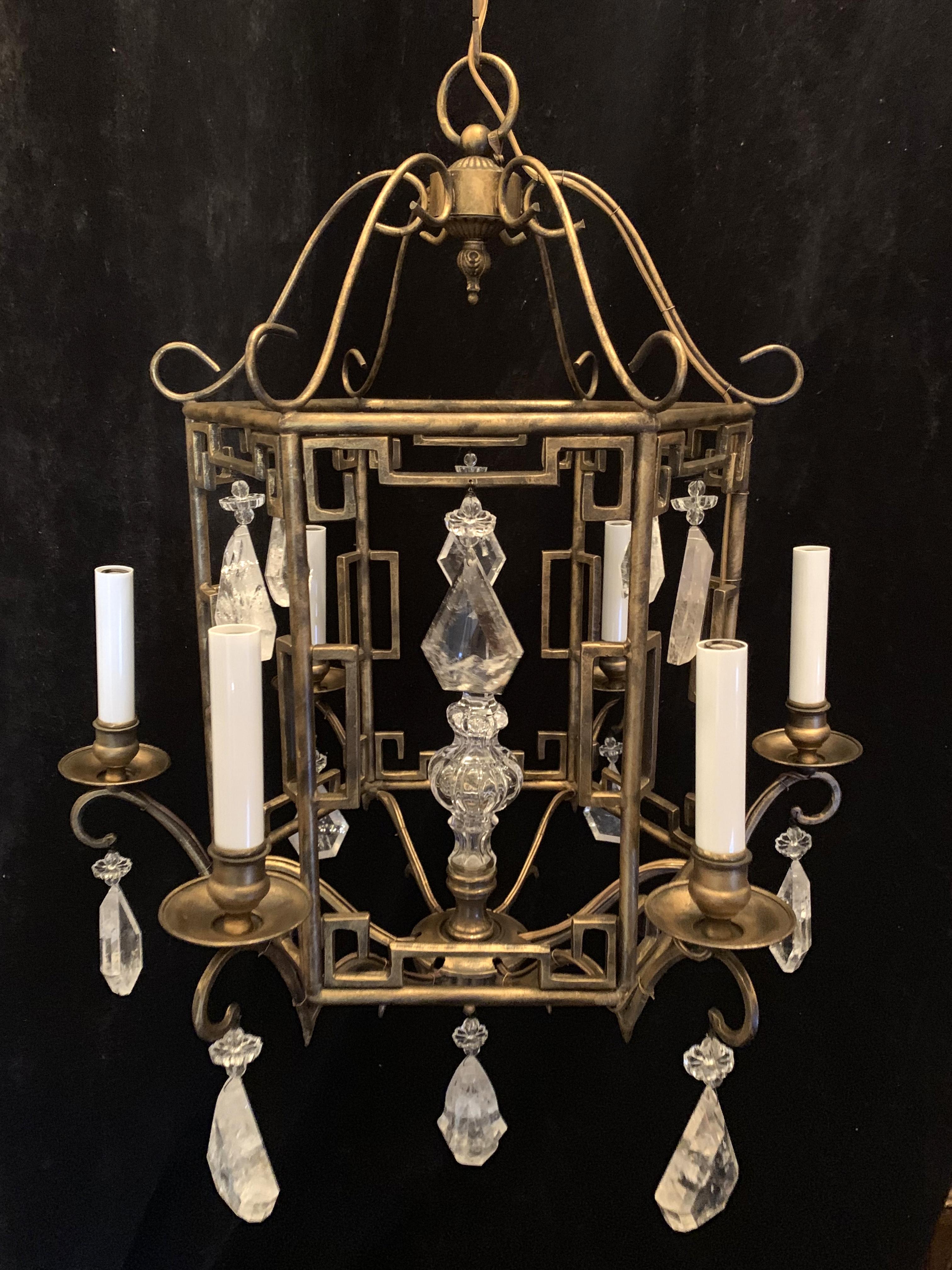 A wonderful French Baguès style pagoda form chandelier with rock crystals dropping from beades and flowers throughout and centred with a crystal spike, finished with a beautiful rock crystal drop on the bottom.