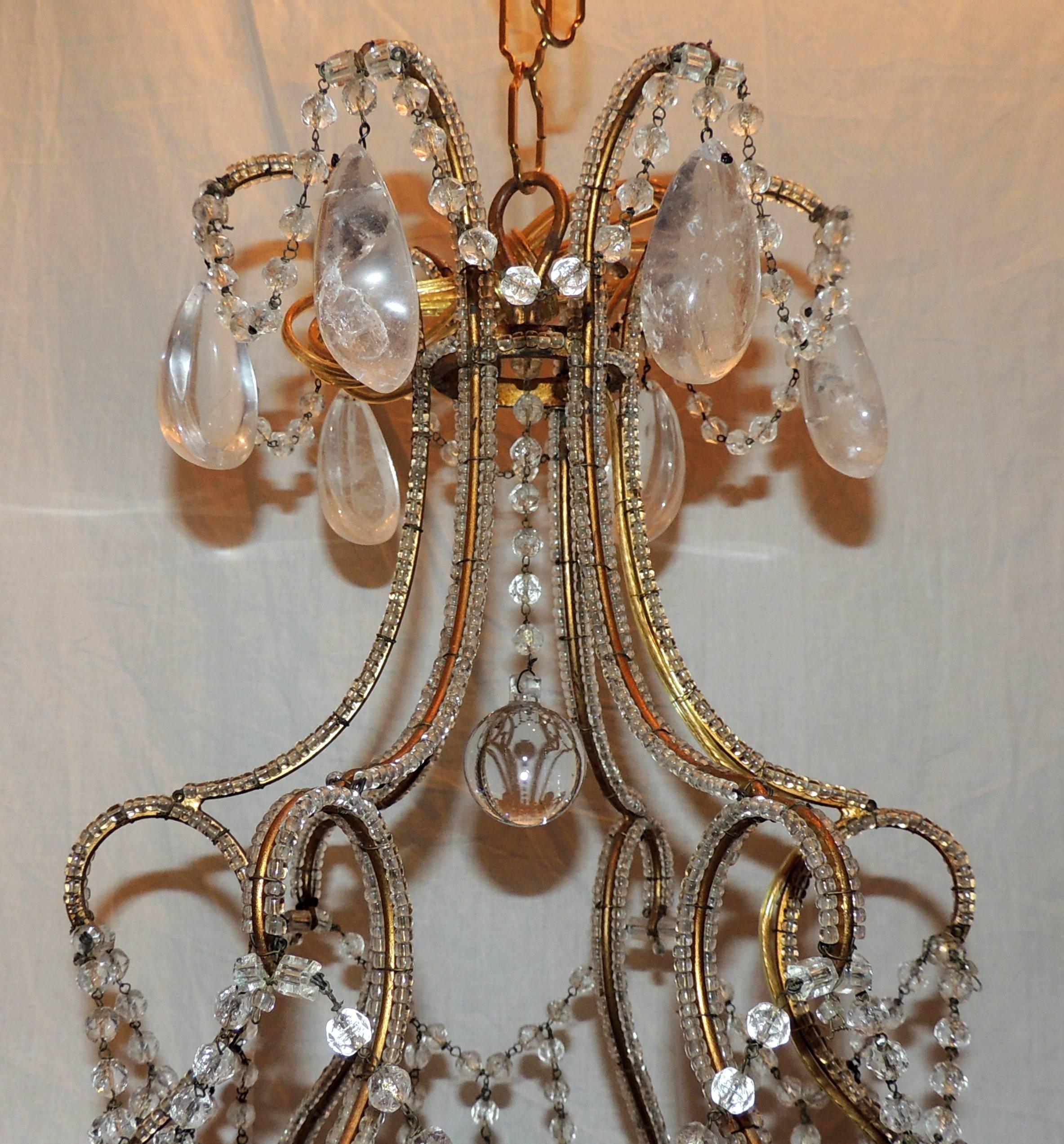 A wonderful French beaded body and rock crystal drop, chandelier in the manner of Maison Baguès with a bird cage frame with Baccarat crystal bobeches.