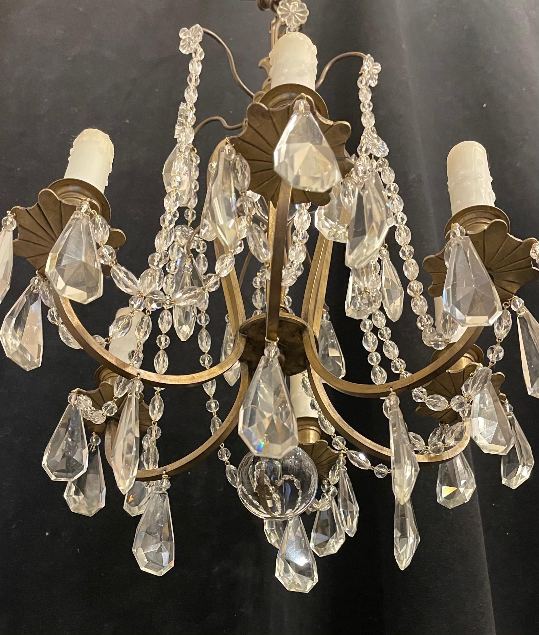 A wonderful French bronze & crystal with beaded swag and flower petite 6 candelabra light chandelier in the manner of Bagues
completely rewired and accompanied by chain and canopy as well as mounting hardware for installation.