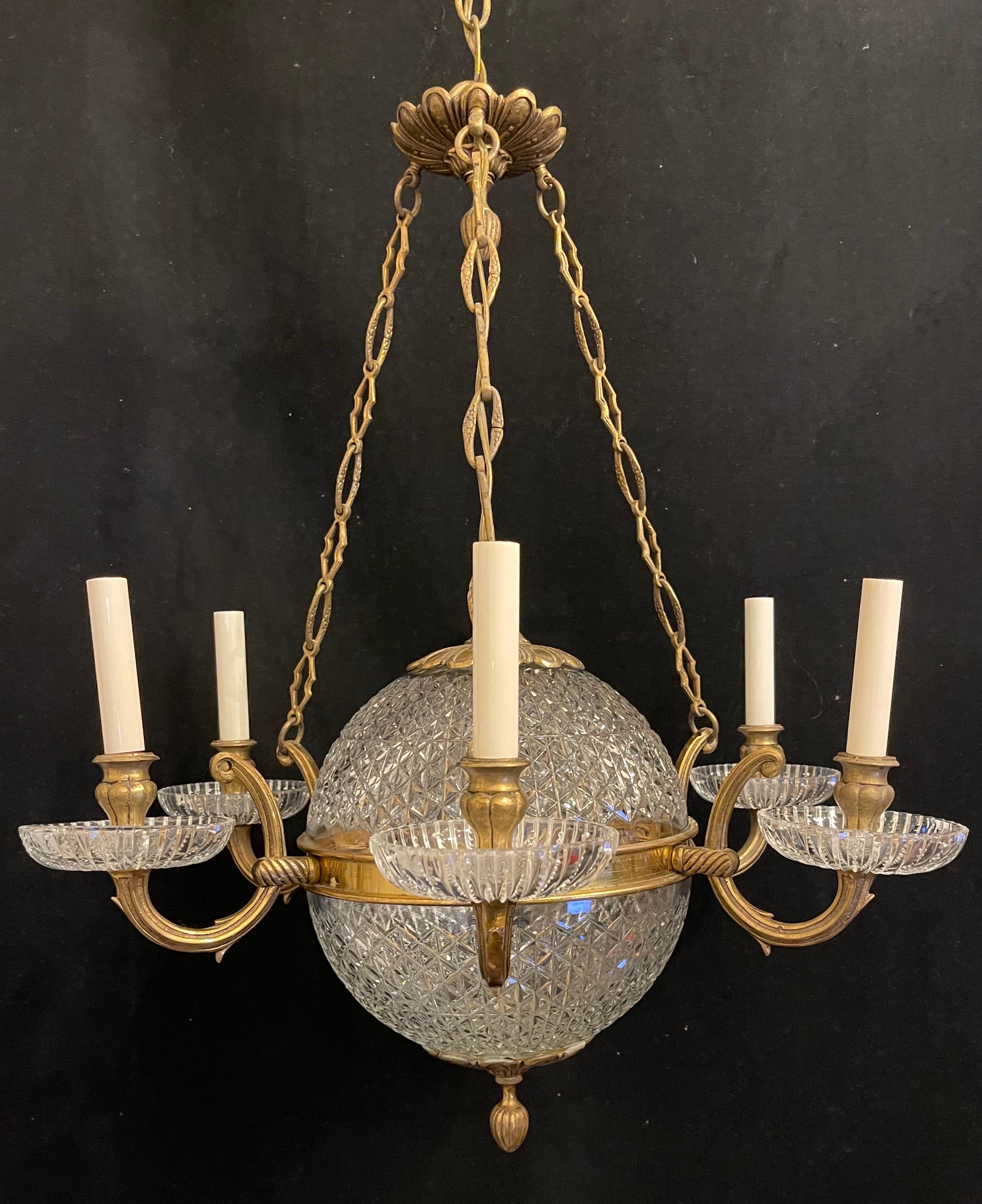 A Wonderful French bronze crystal neoclassical Empire Regency orb ball form chandelier with six candelabra lights.