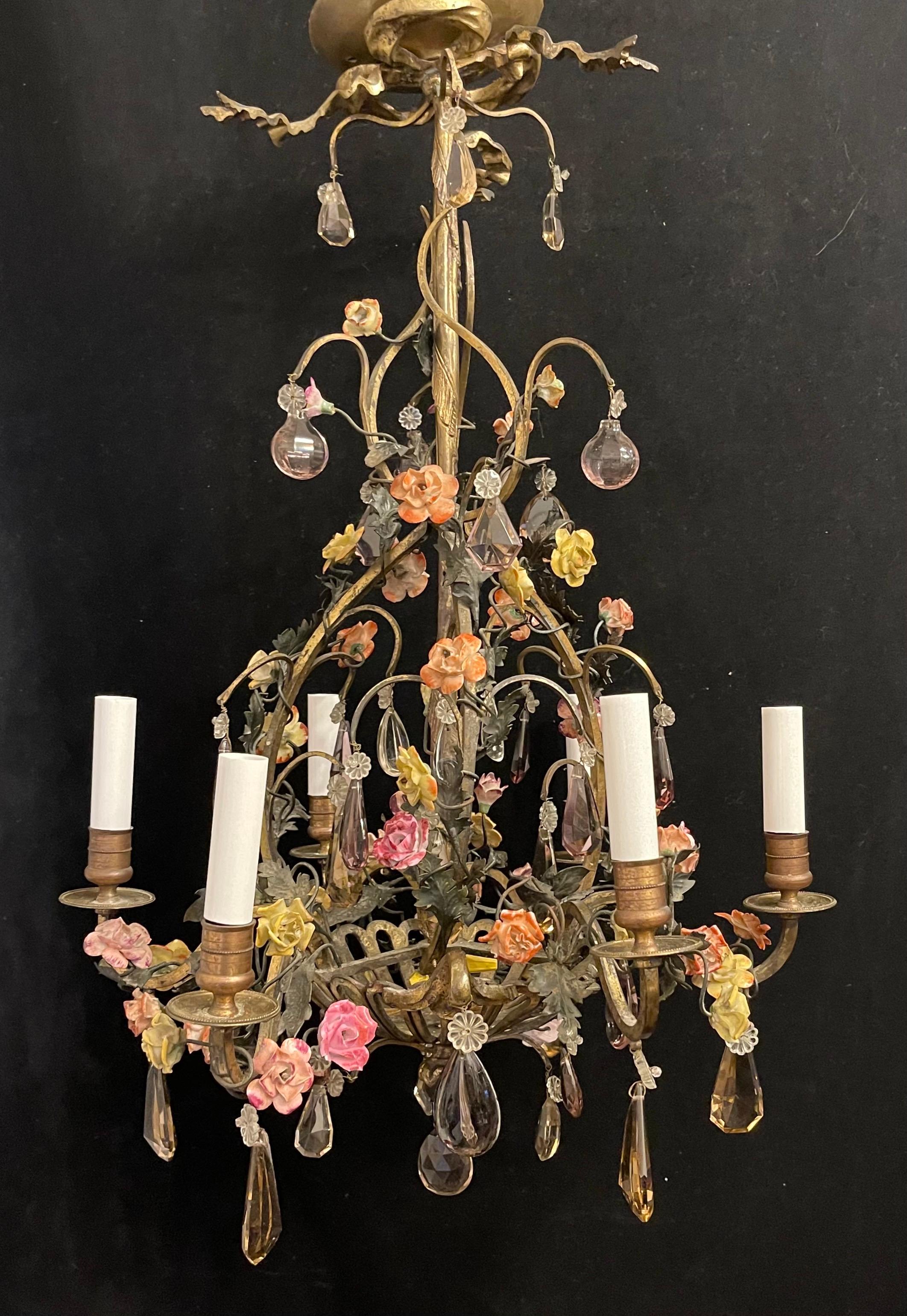 A Wonderful French bronze & amethyst crystal Louis XV Style porcelain flowers, basket form chandelier with ribbon & bow top< having 6 candelabra lights each taking 40 watts per socket.