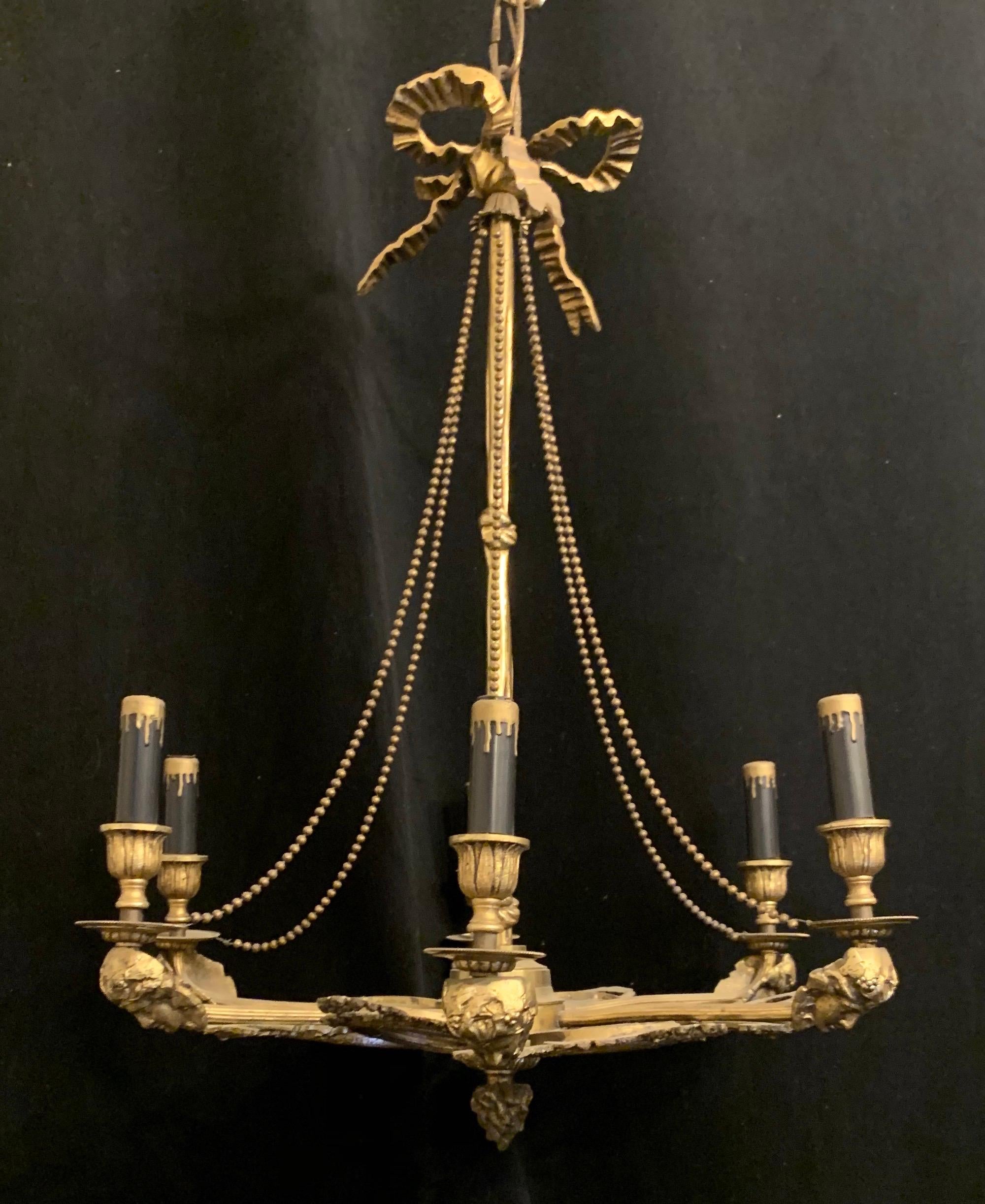 A wonderful French bronze fixture with oval mirror panels and alternating lady figural arms with bow top and ormolu swags.