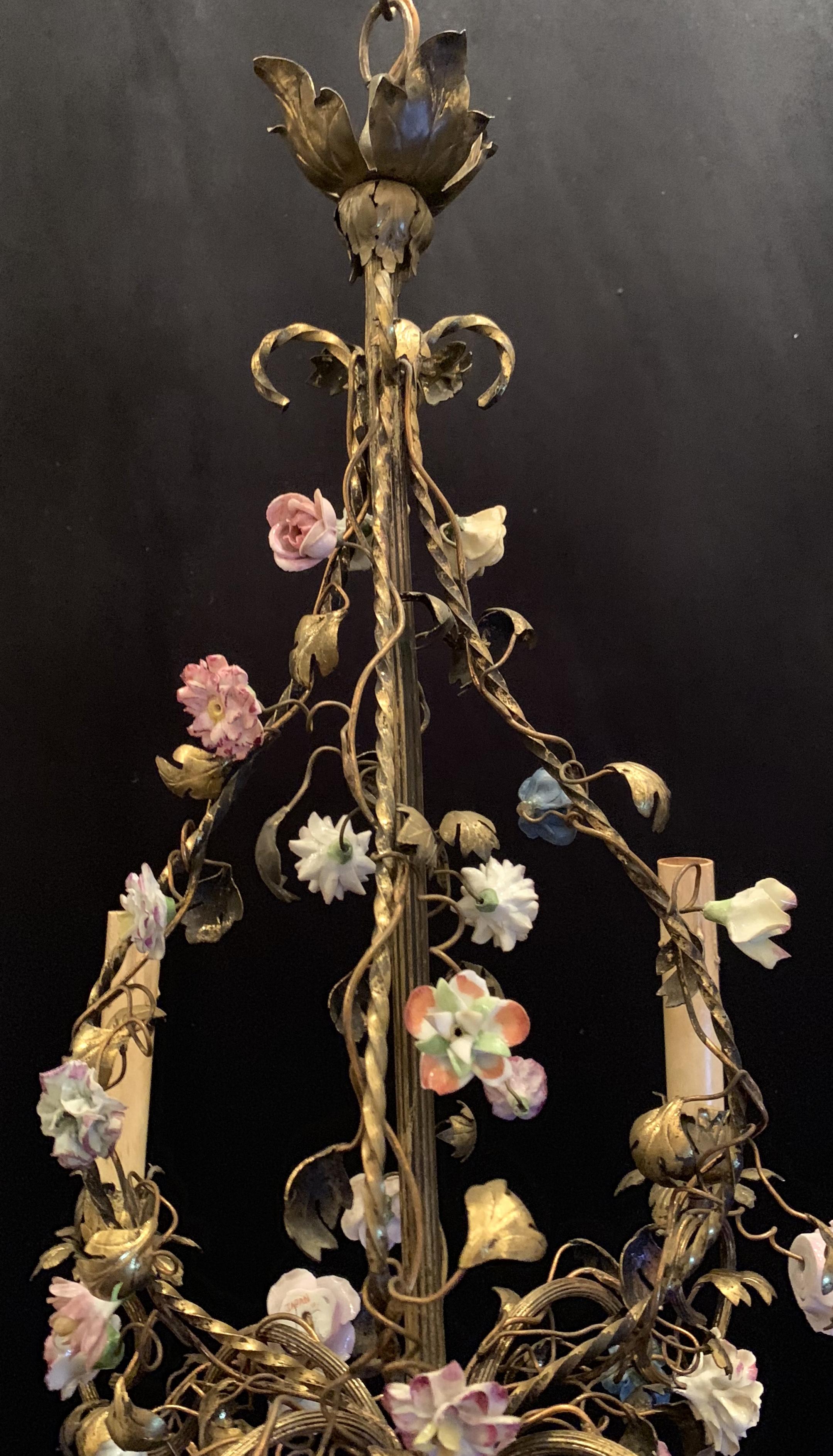 A wonderful French gilt bronze and porcelain flower four candelabra light, cage / basket form chandelier.