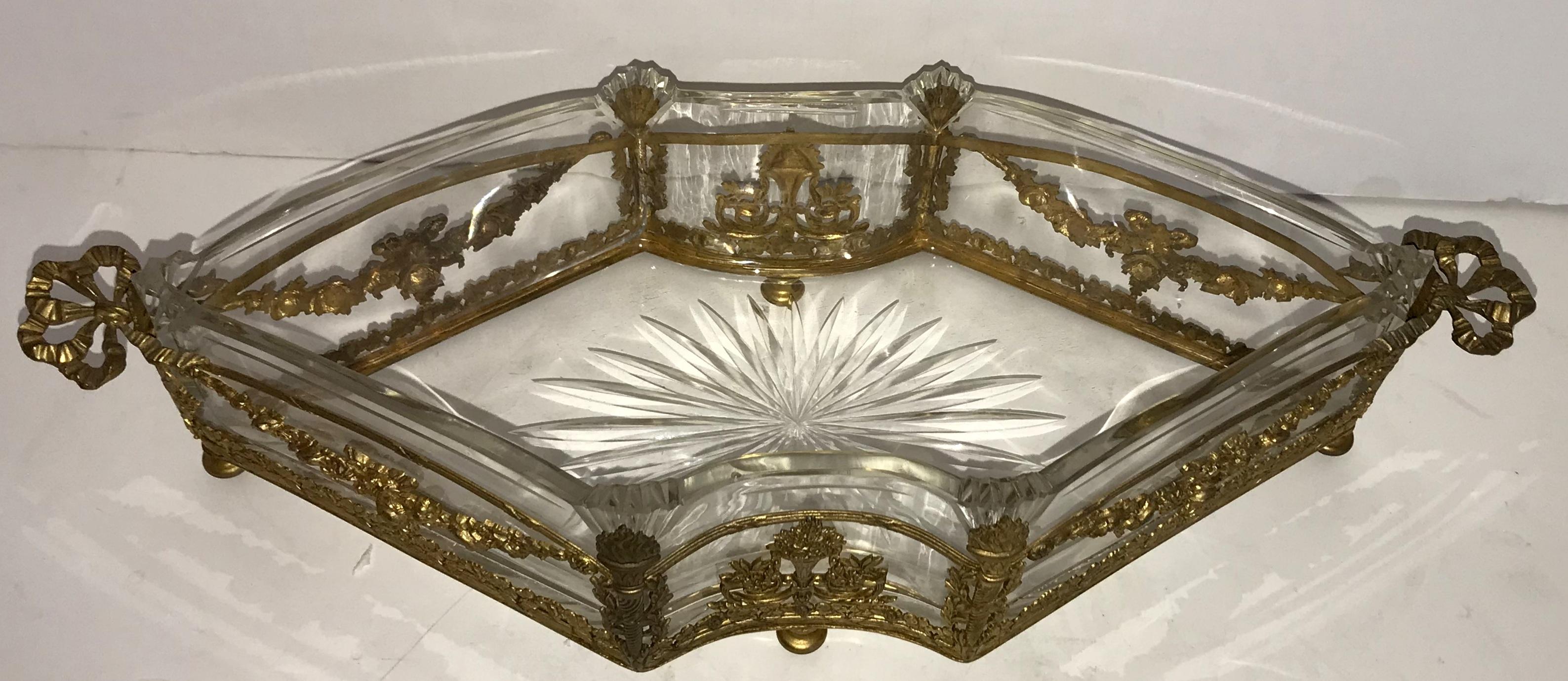 A wonderful very fine French doré bronze and etched cut crystal centerpiece / jardinière with swags, bows and torches.
Believed to be baccarat, unsigned.