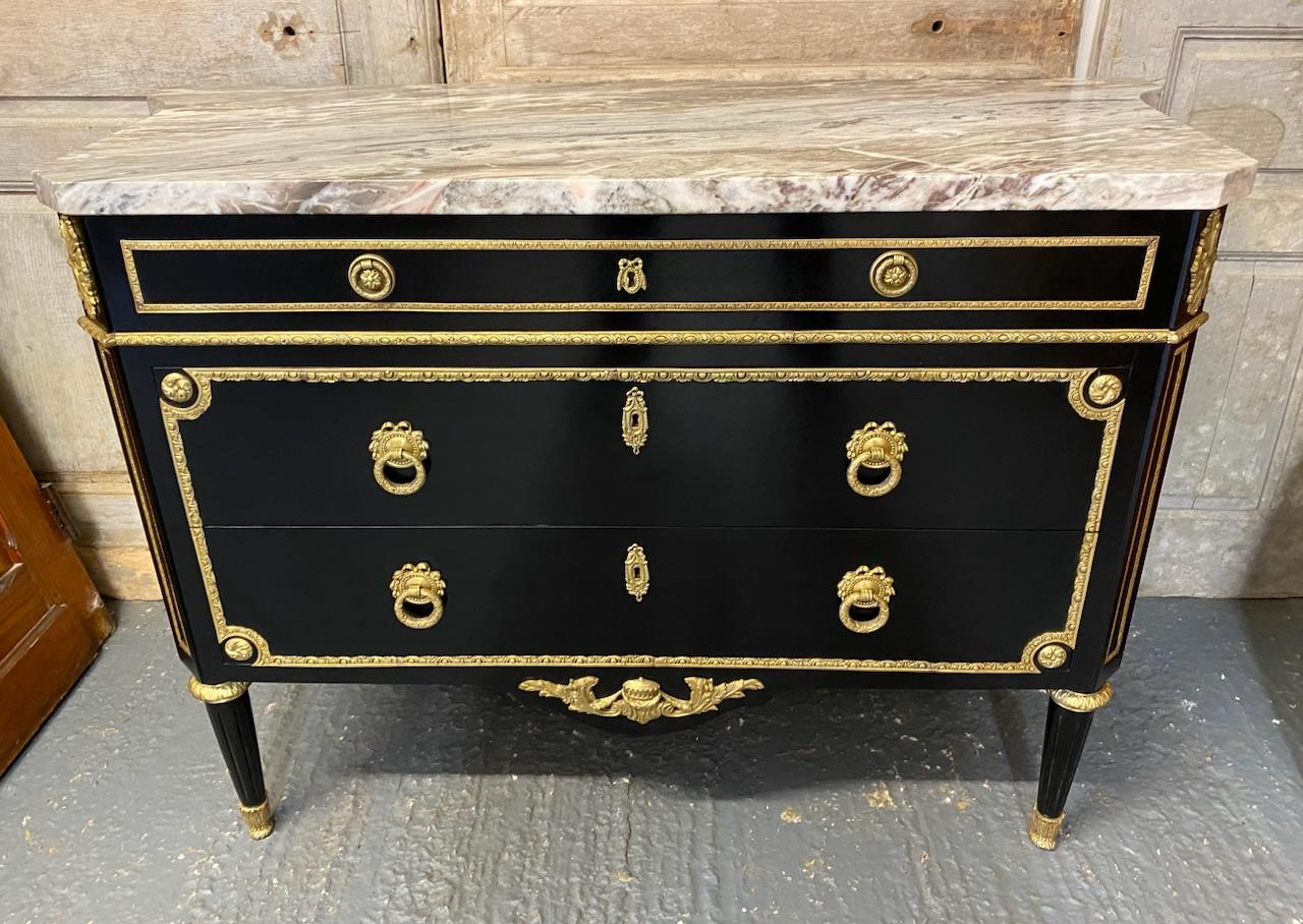 A very good quality French commode chest of drawers. Having thick original variegated marble top in perfect condition. Covered in striking and excellent quality ormolu mounts and brass. Concave sides and 3 drawers which all run smoothly and are