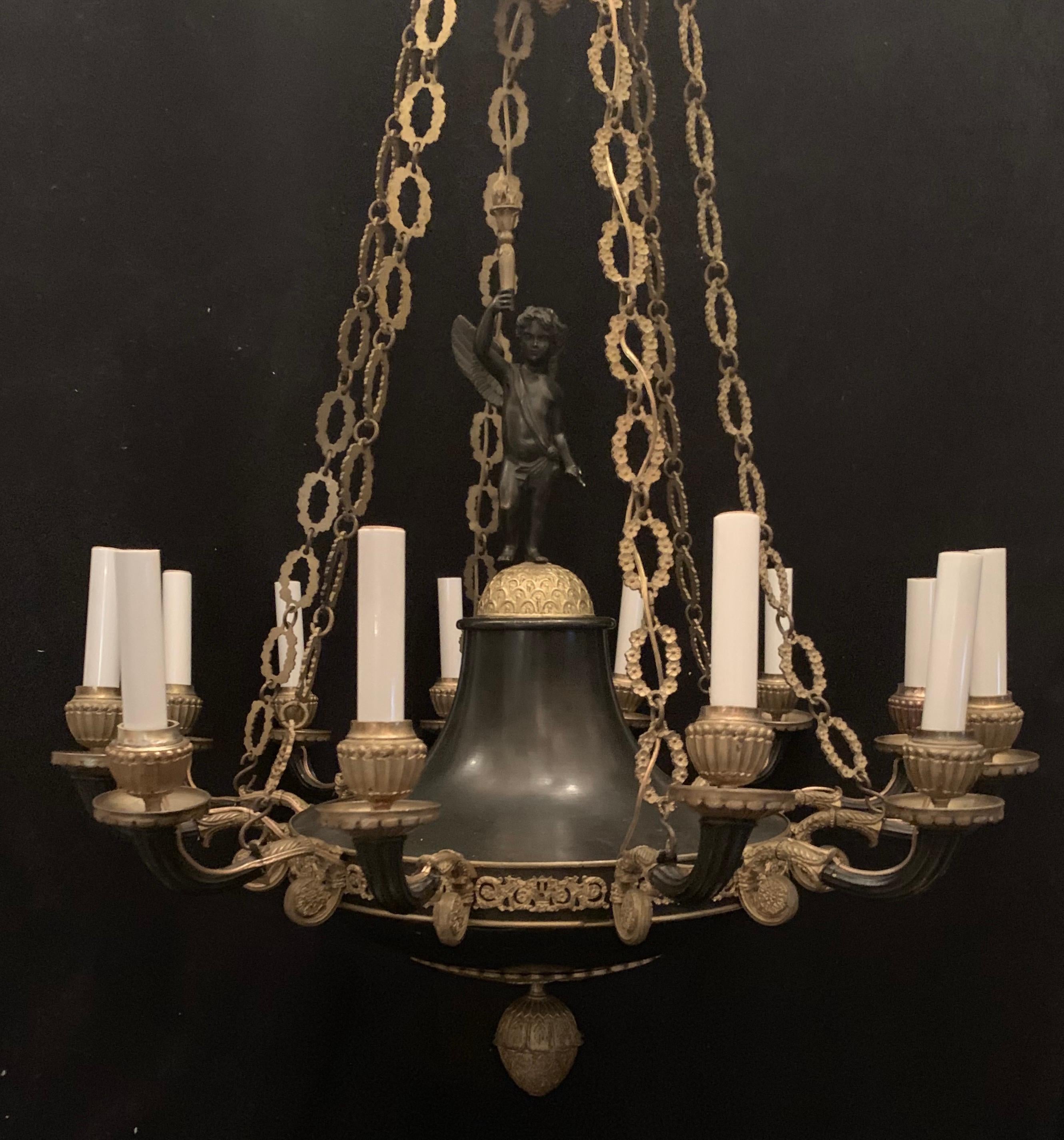 A wonderful French Empire doré and patinated bronze two-tone neoclassical cherub center medallion 12 light chandelier completely rewired with new candelabra sockets

Currently 26