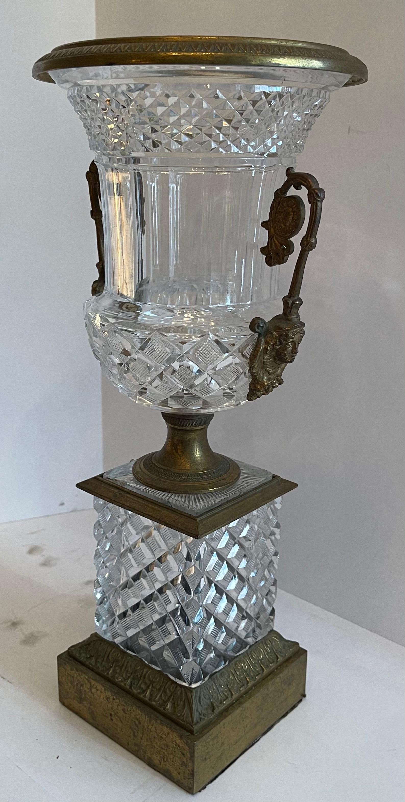A wonderful French Empire / neoclassical cut crystal and bronze ormolu mounted urn with lady figure handles centerpiece.

  