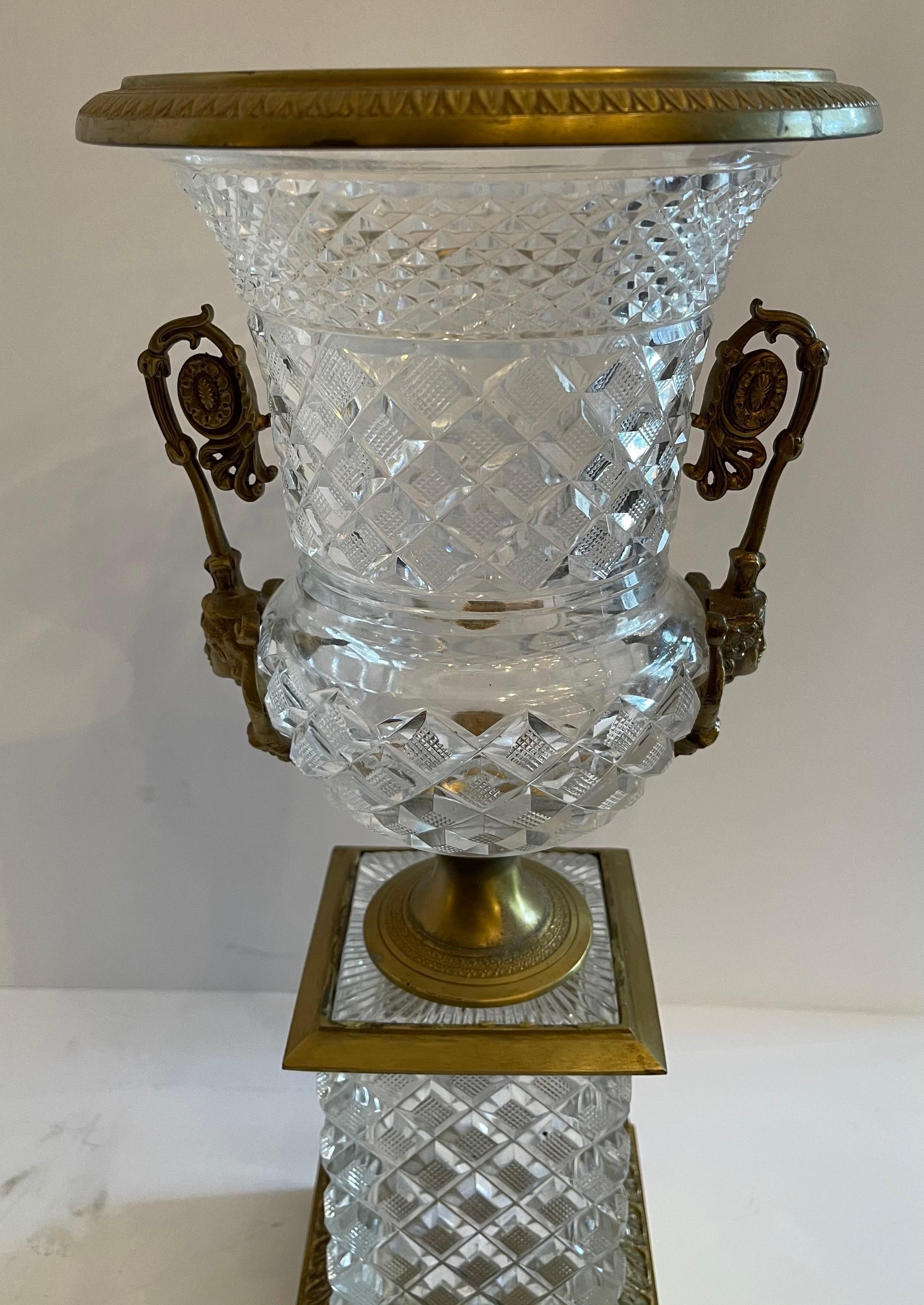 A wonderful French Empire / neoclassical cut crystal and bronze ormolu mounted urn with lady figure handles centerpiece.

 