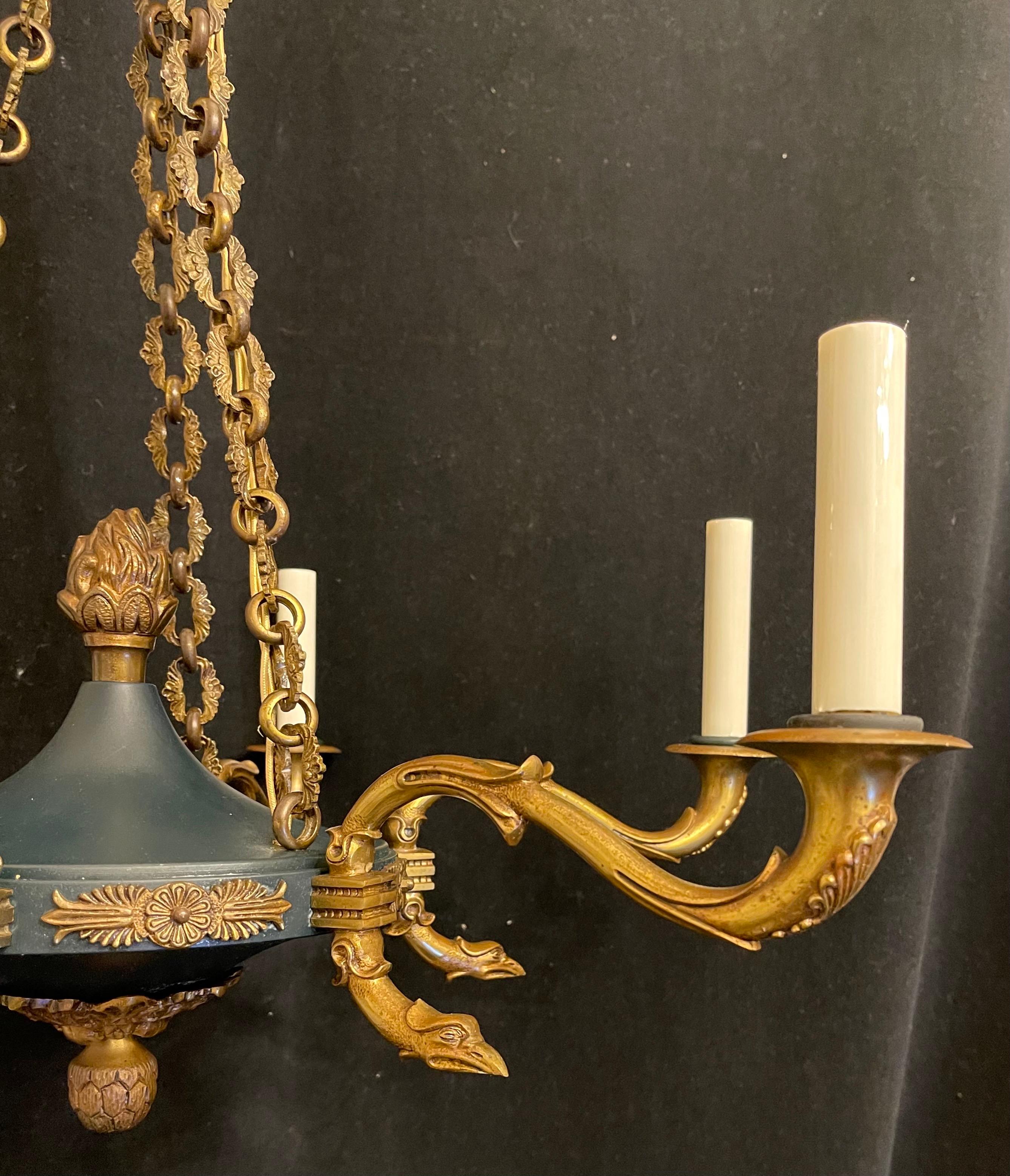 A wonderful French empire neoclassical patinated ormolu bronze 6-light chandelier fixture
completely rewired with new sockets, comes with chain canopy and mounting hardware.