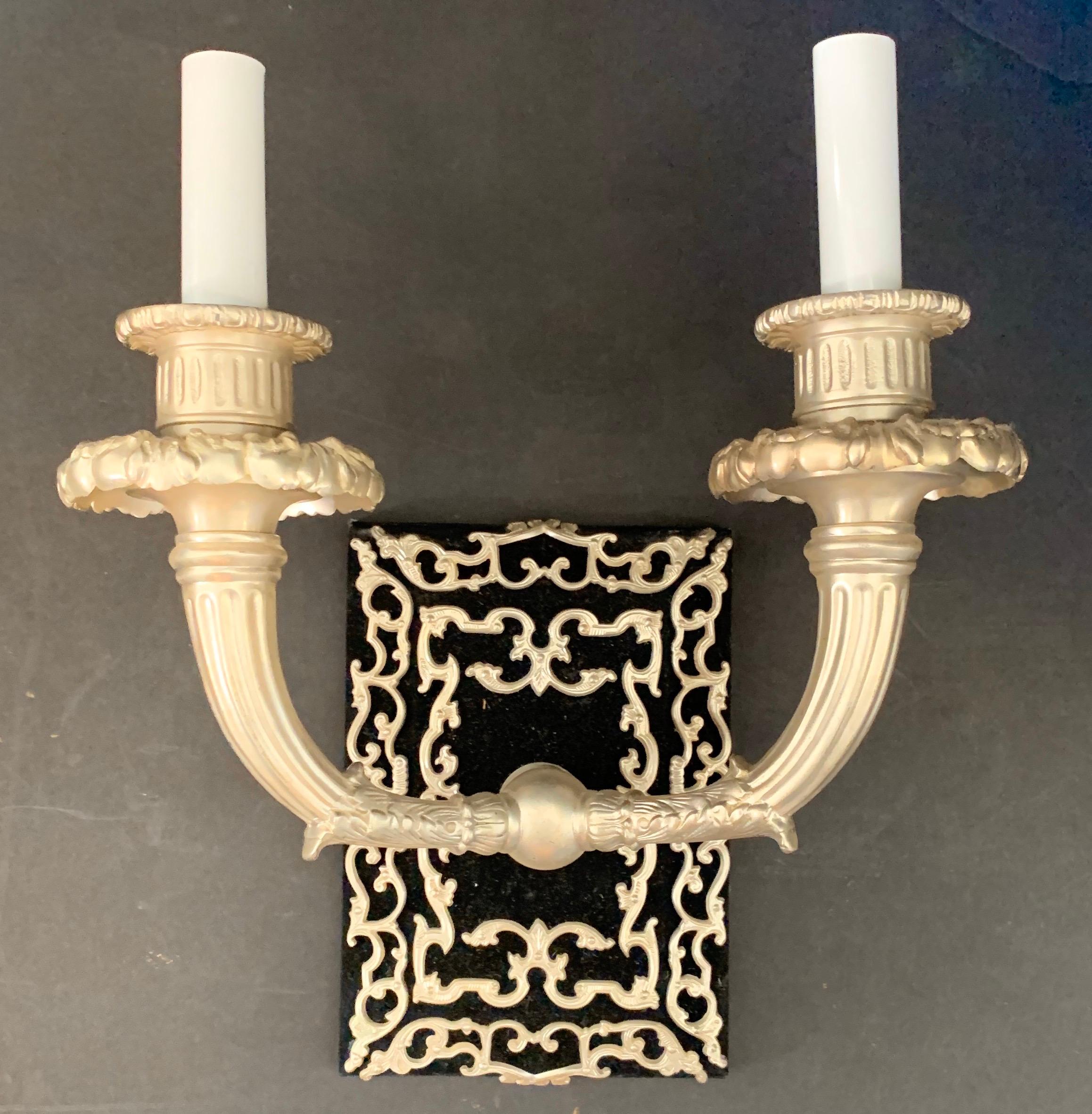 A wonderful French Empire / neoclassical silvered bronze set of 3 sconces in the manner of Caldwell set on black velvet Backplate with silvered bronze ormolu mounts.
Rewired and ready to enjoy.