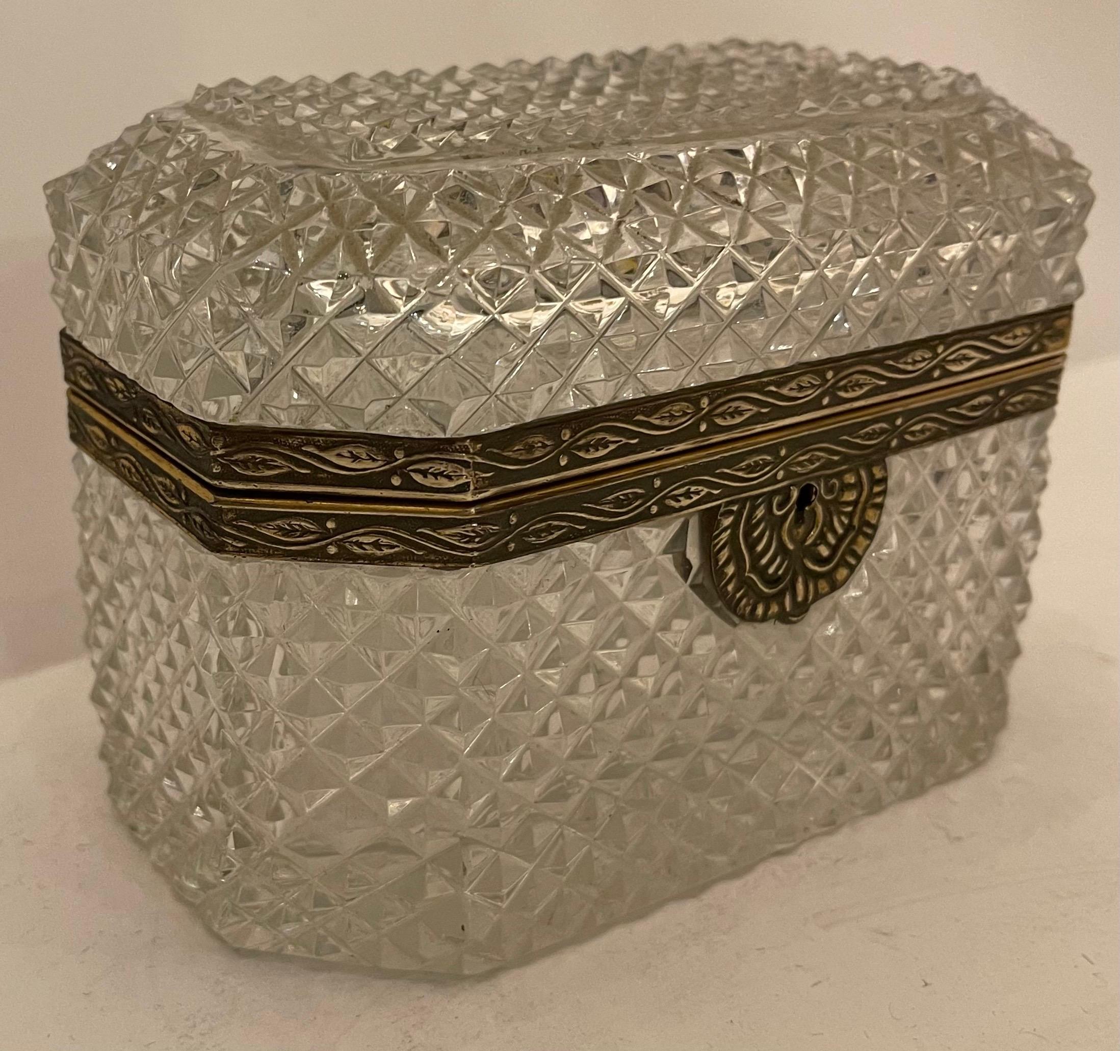 A wonderful French faceted cut crystal bronze ormolu-mounted eight sided casket jewelry box with fine detail bronze key hole.
In the manner of Baccarat.
