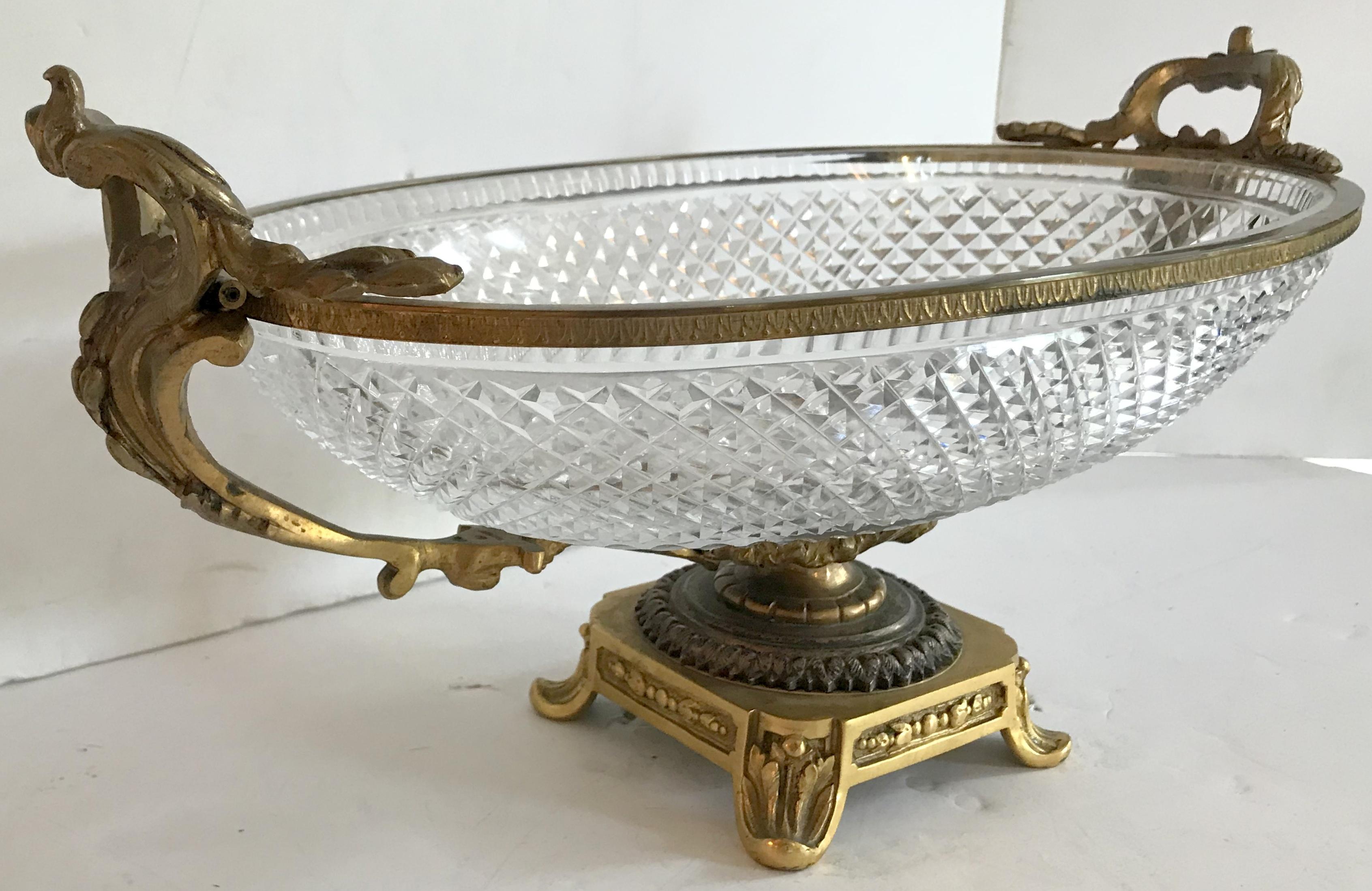 A wonderful large French gilt bronze and cut crystal ormolu-mounted centerpiece with filigree pedestal oval bowl with two open handles.
In the manner of Baccarat.