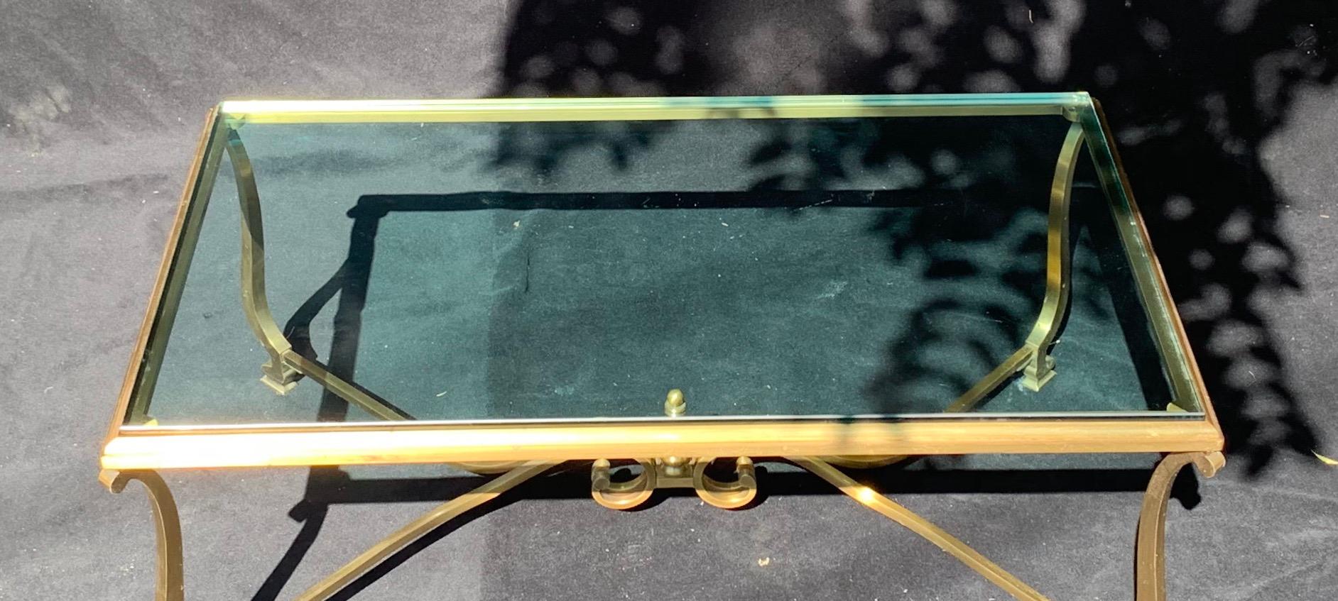 A wonderful French gilt bronze and glass top rectangular coffee / cocktail table
Wear to bronze and glass top due to regular use.
