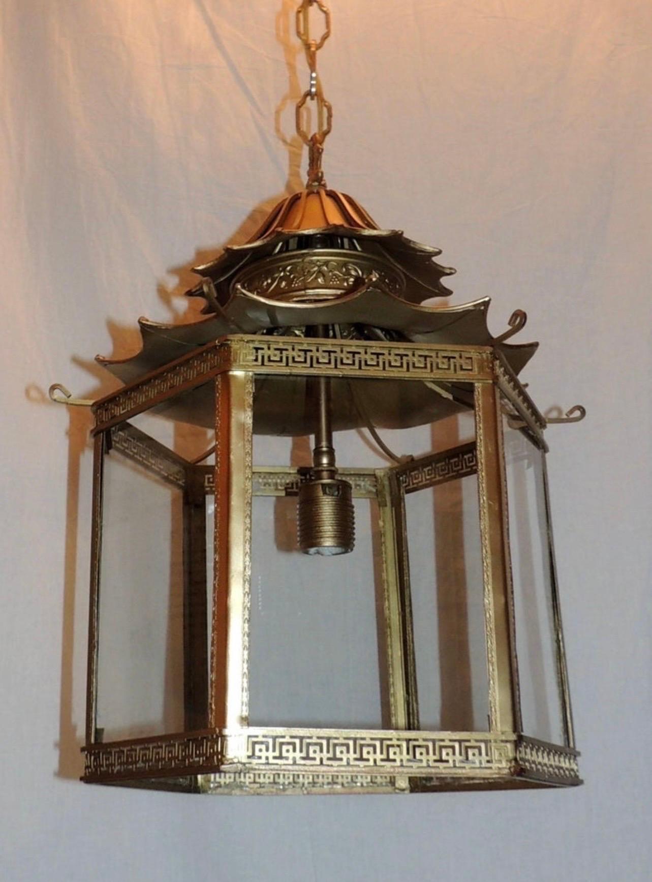 Wonderful French gilt bronze pagoda 6 panel Chinoiserie octagonal glass lantern fixture, rewired with a new socket taking up to 100 watts. This fixture comes with as much chain as you need as well as canopy and mounting hardware.