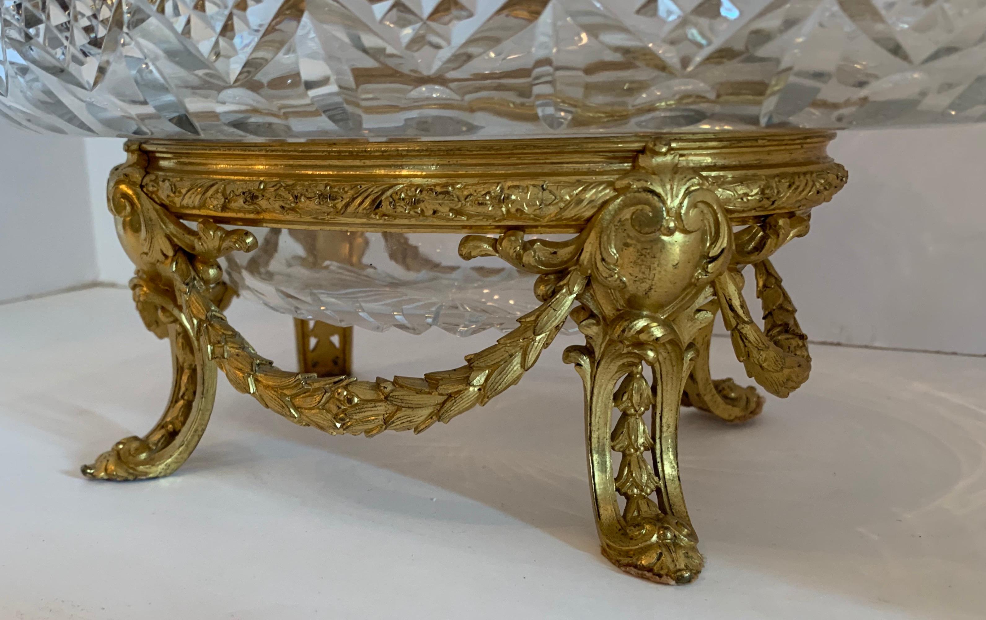 A wonderful French gilt doré bronze ormolu swag, cut crystal oval inset bowl centerpiece.