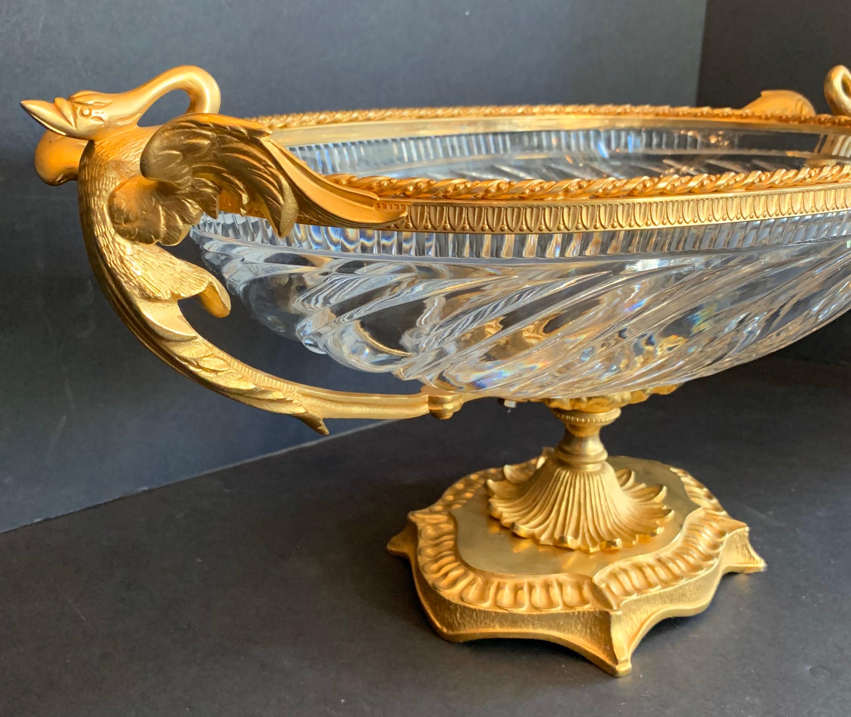 A wonderful French gilt doré bronze swan handle ormolu and cut crystal centerpiece, in the manner of Baccarat.