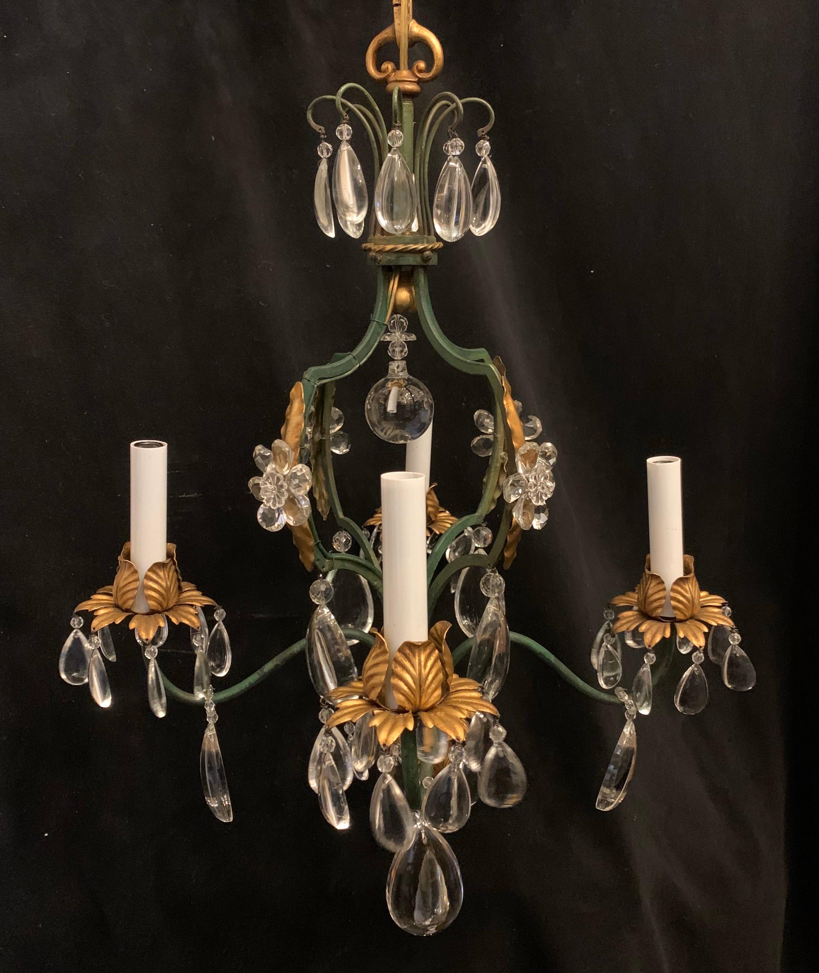 A wonderful French green and gold gilt tole bird cage form with crystal flower and drops, petite chandelier in the manner of Baguès.