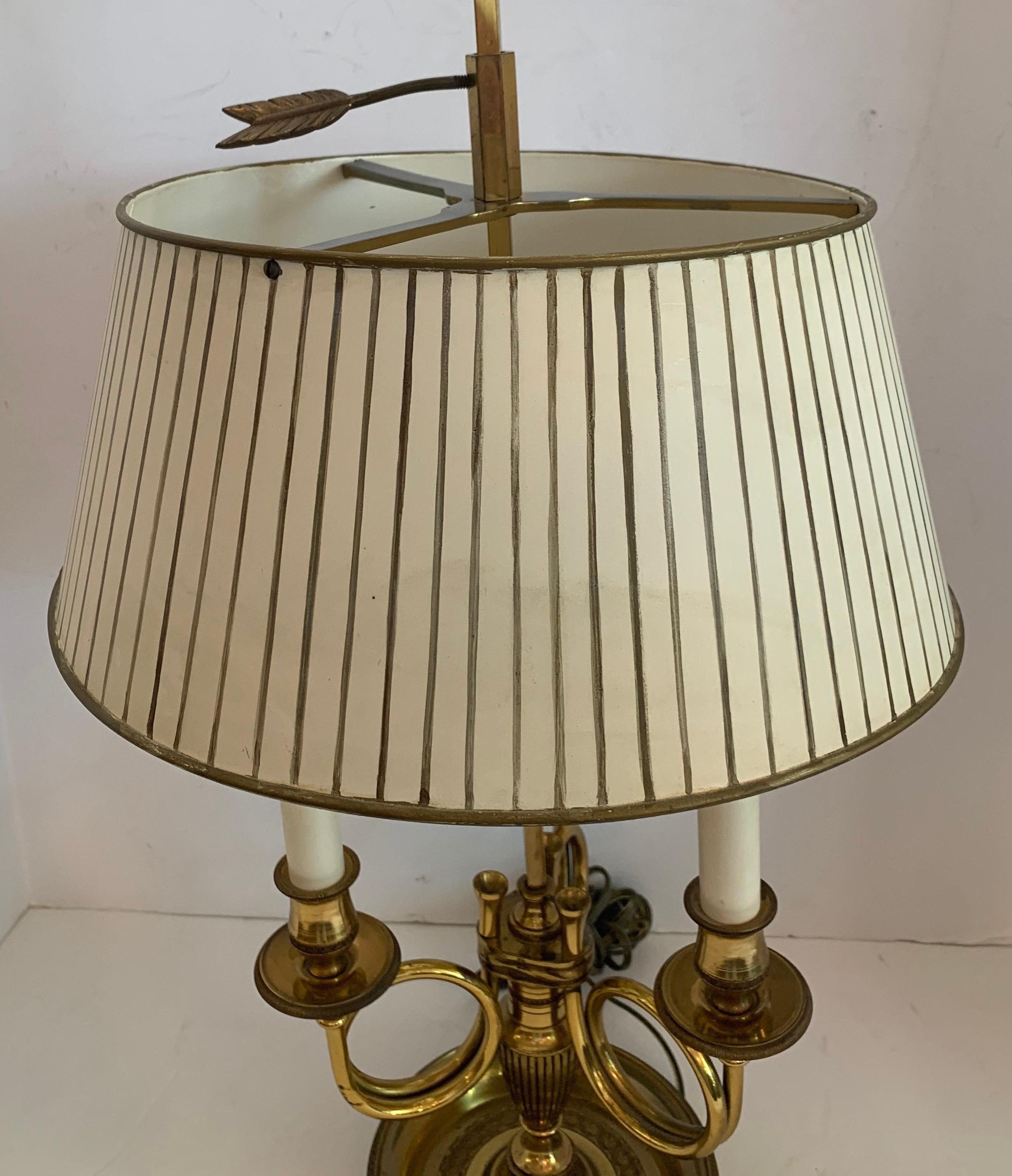 A wonderful French horn neoclassical regency bronze Bouillotte lamp with hand painted tole shade.