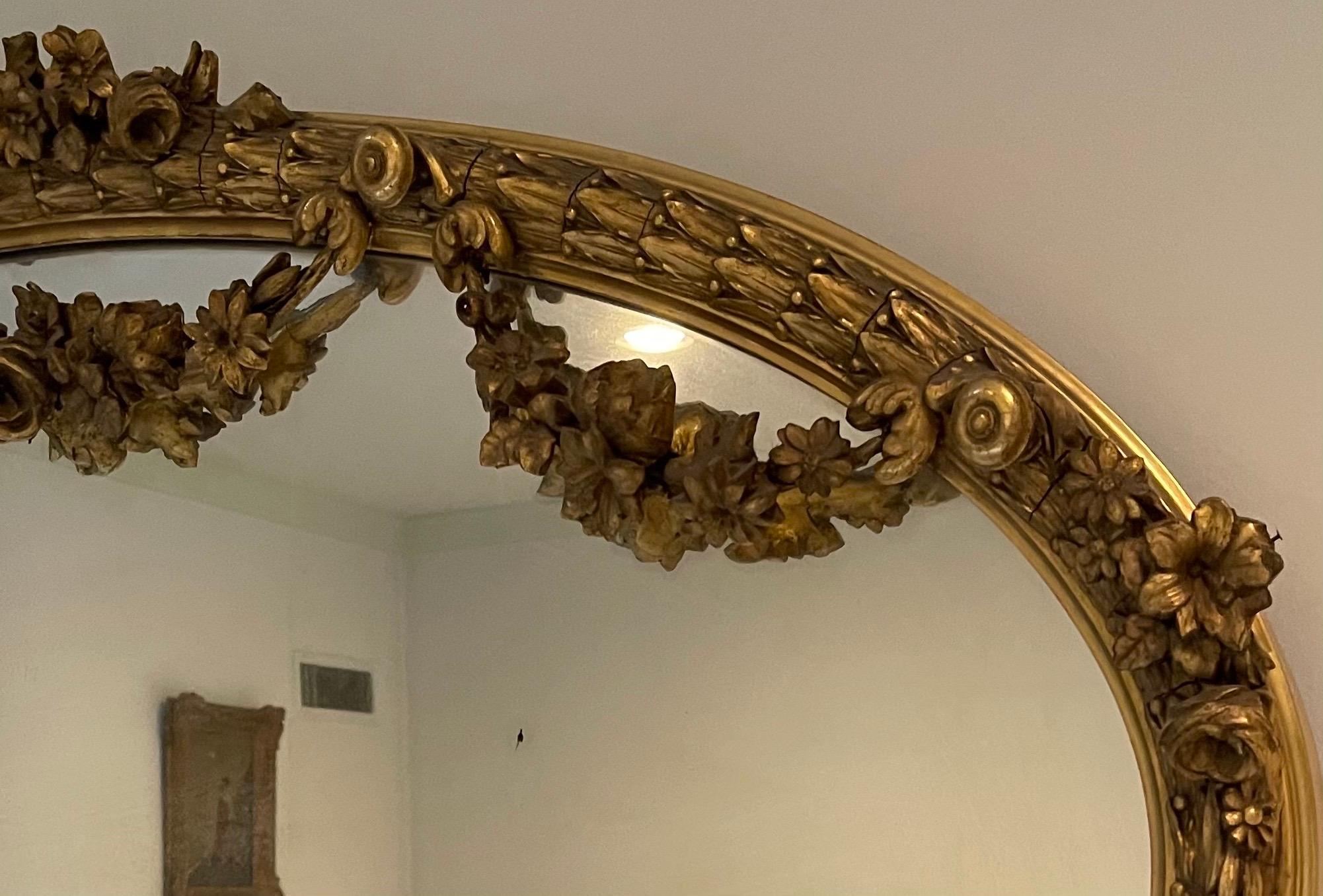 Wonderful French Louis XVI Horizontal Oval Giltwood Swag Over Mantle Mirror In Good Condition In Roslyn, NY