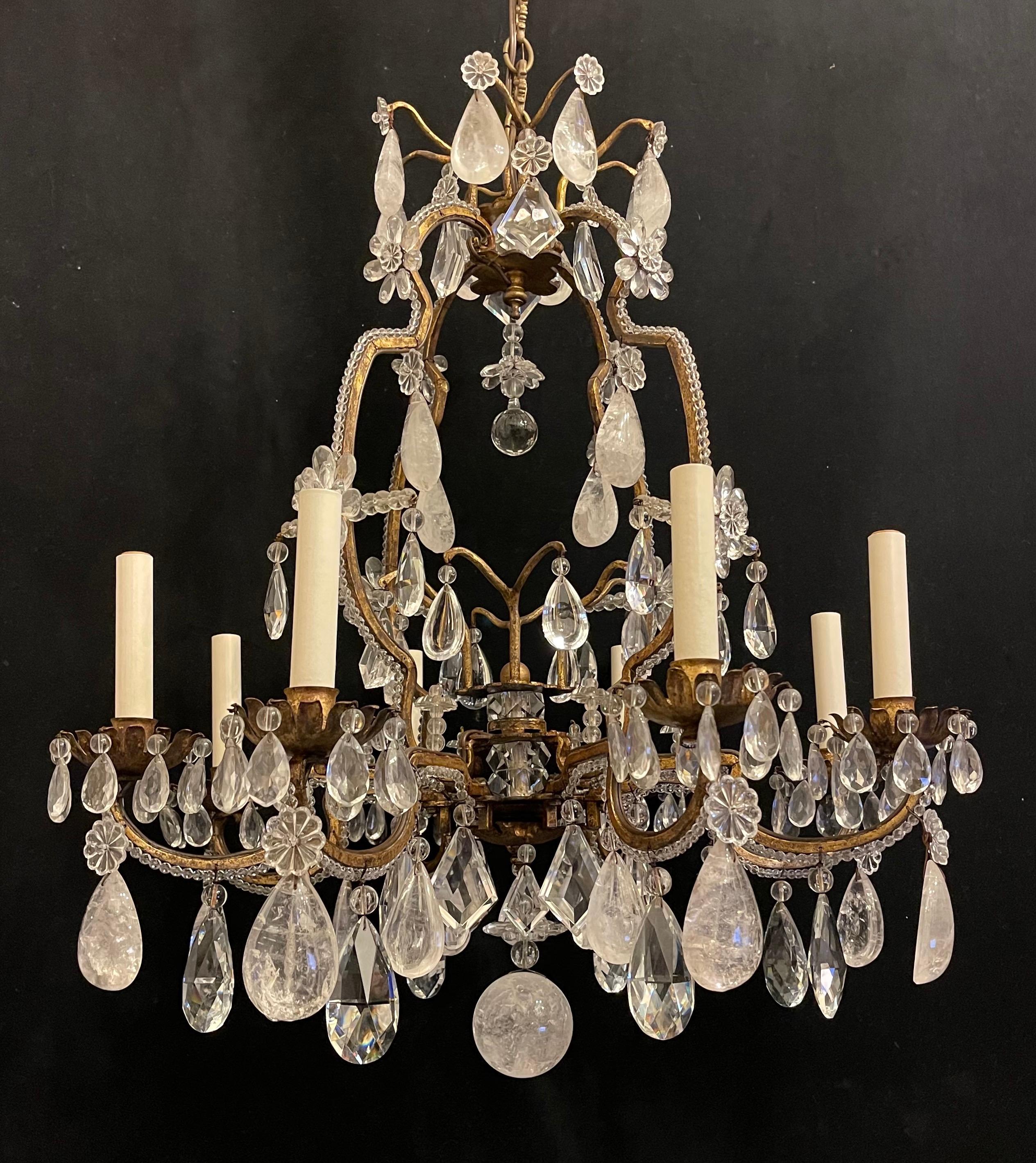 A Wonderful French Maison Baguès Louis XV style rock crystal, crystal beaded and flower 8 candelabra light chandelier in the manner of Maison Jansen.
Accompanied with chain canopy and mounting hardware for installation.